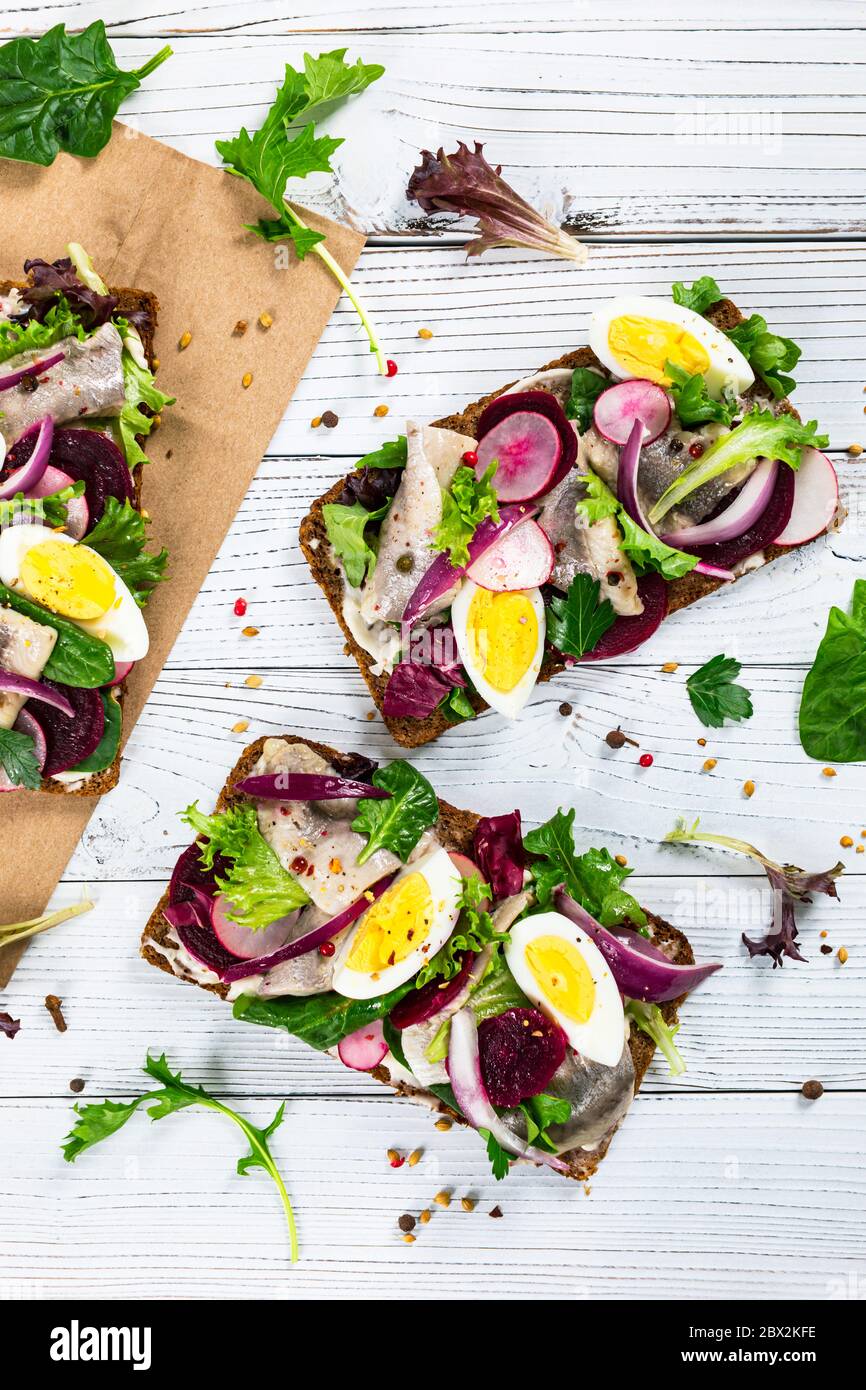 Pickled Marinated Herring and Beetroot Open Sandwich on Rye Bread