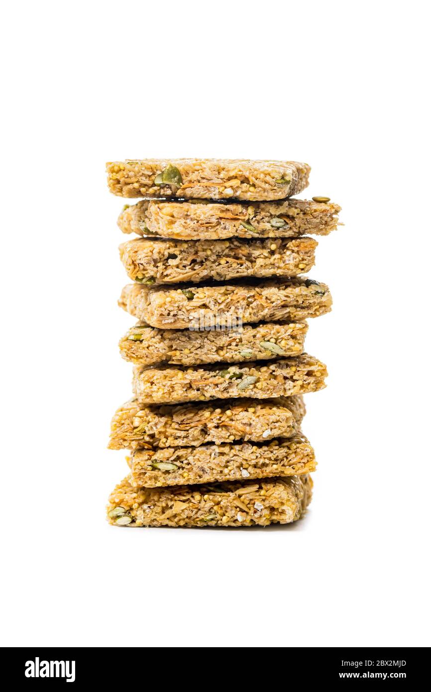 Multigrain Cereal Crunchy Squares Bars with Pumpkin Seeds Background. Healthy Bar Snack on White Background Stock Photo