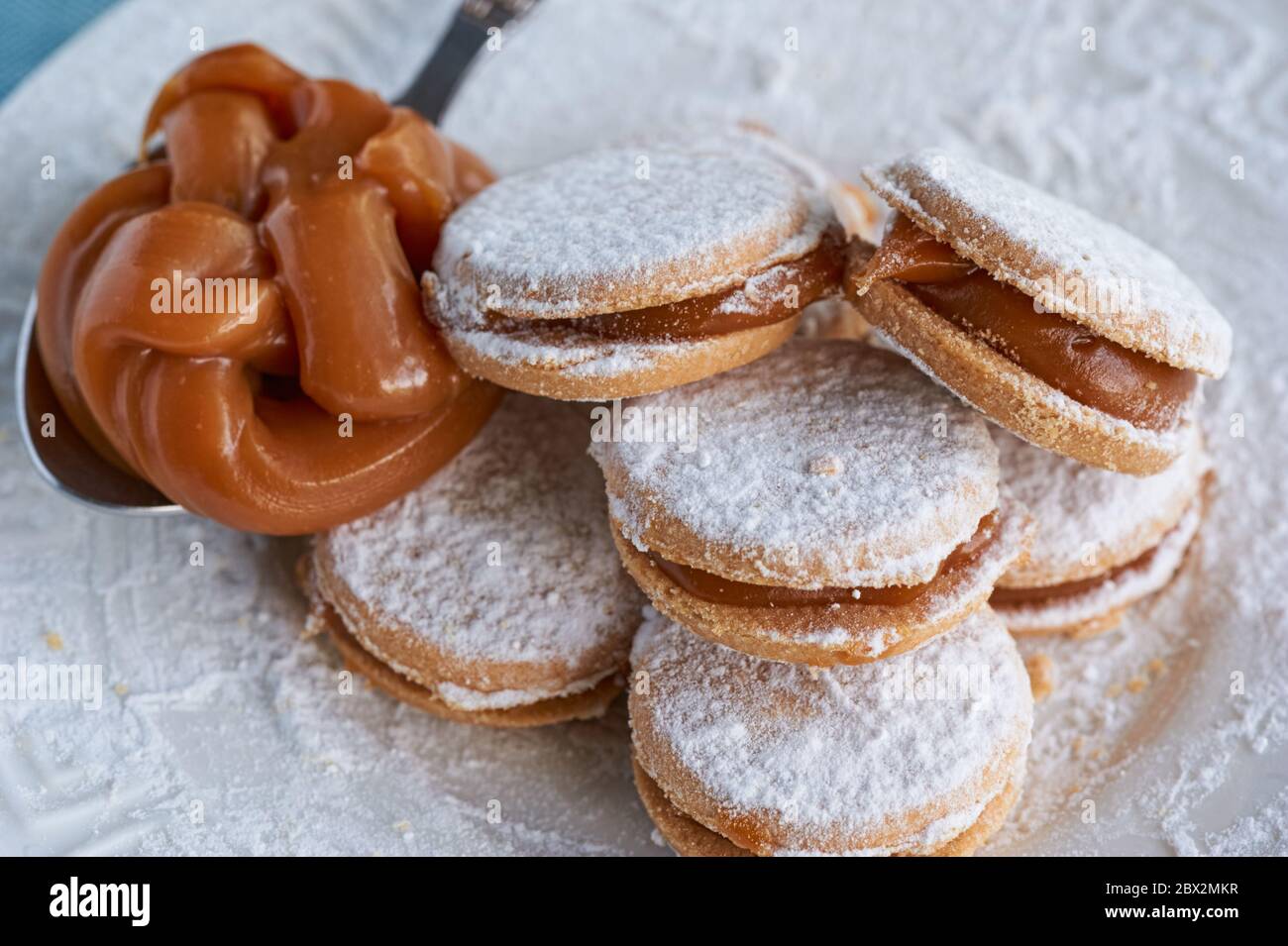 Alfajores: Traditional Peruvian cookies filled with caramel and white sugar dust on top. Stock Photo