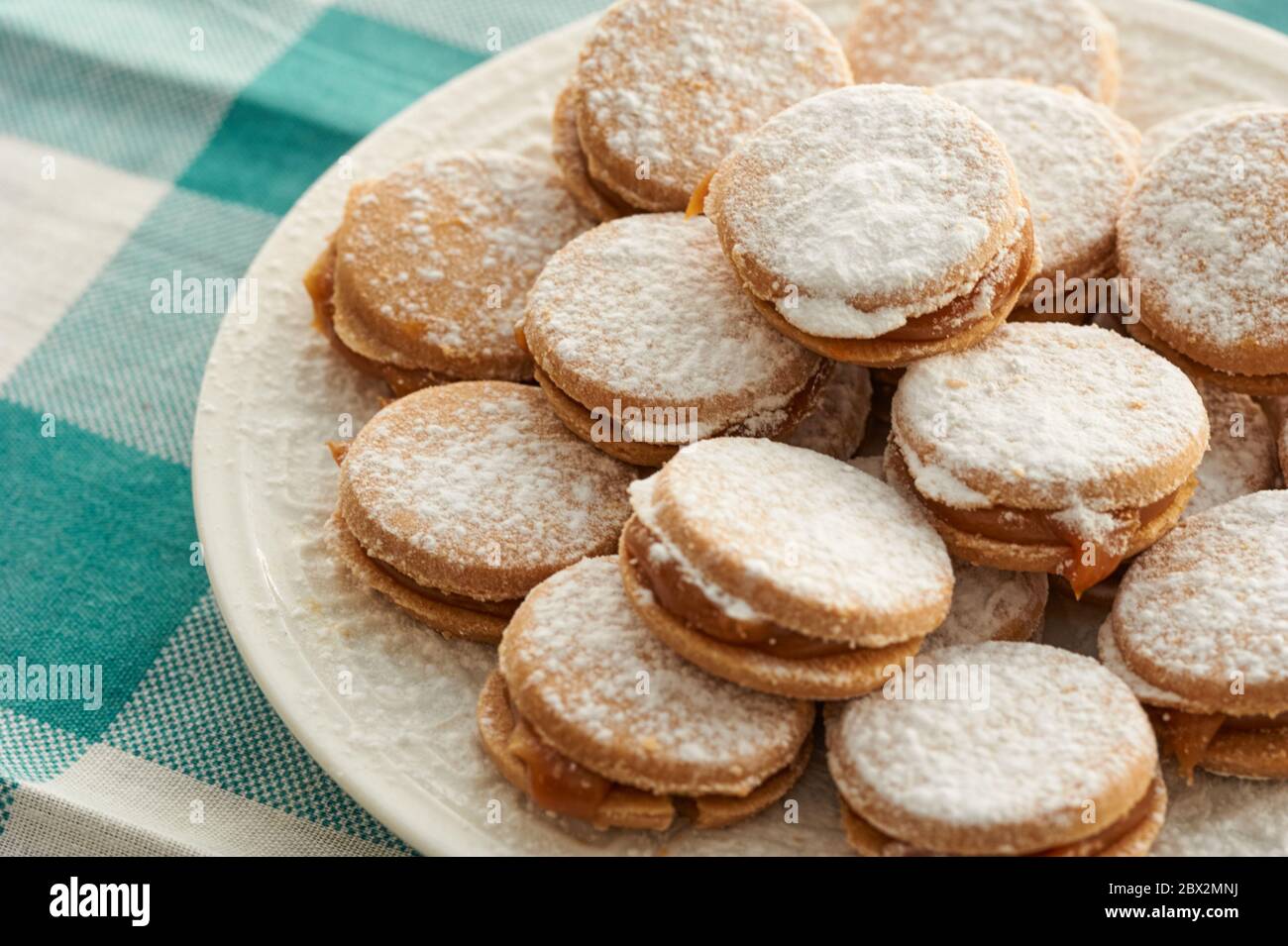 Alfajores: Traditional Peruvian cookies filled with caramel and white sugar dust on top. Stock Photo