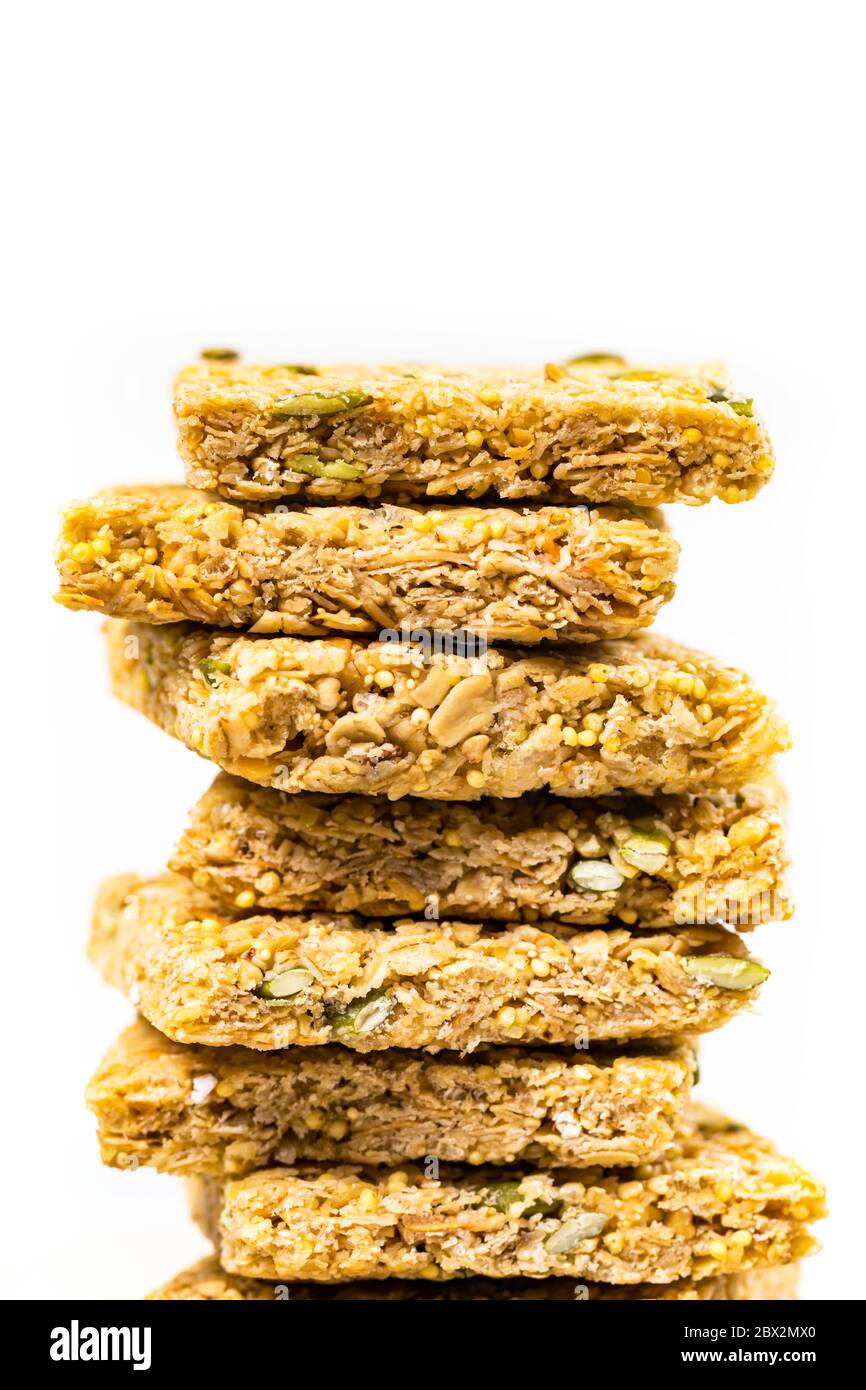 Multigrain Cereal Crunchy Squares Bars with Pumpkin Seeds Background. Healthy Bar Snack on White Background Stock Photo