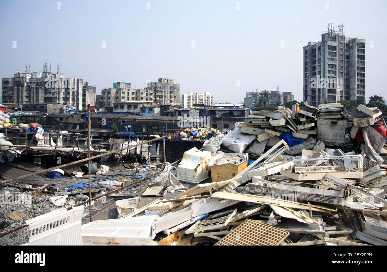 Mumbai, India - Dharavi slum waste rooftops with plastic waste and rubbish on hand-built slum living accommodation, in the middle of the city Stock Photo