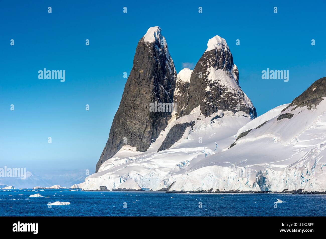 Antarctica, Southern Ocean, Antarctic Peninsula, Graham Land, Lemaire  Channel, Les Tétons de Una, two remarkable peaks at the entrance of the  channel, in reference to a secretary of the BAS (British Antarctic