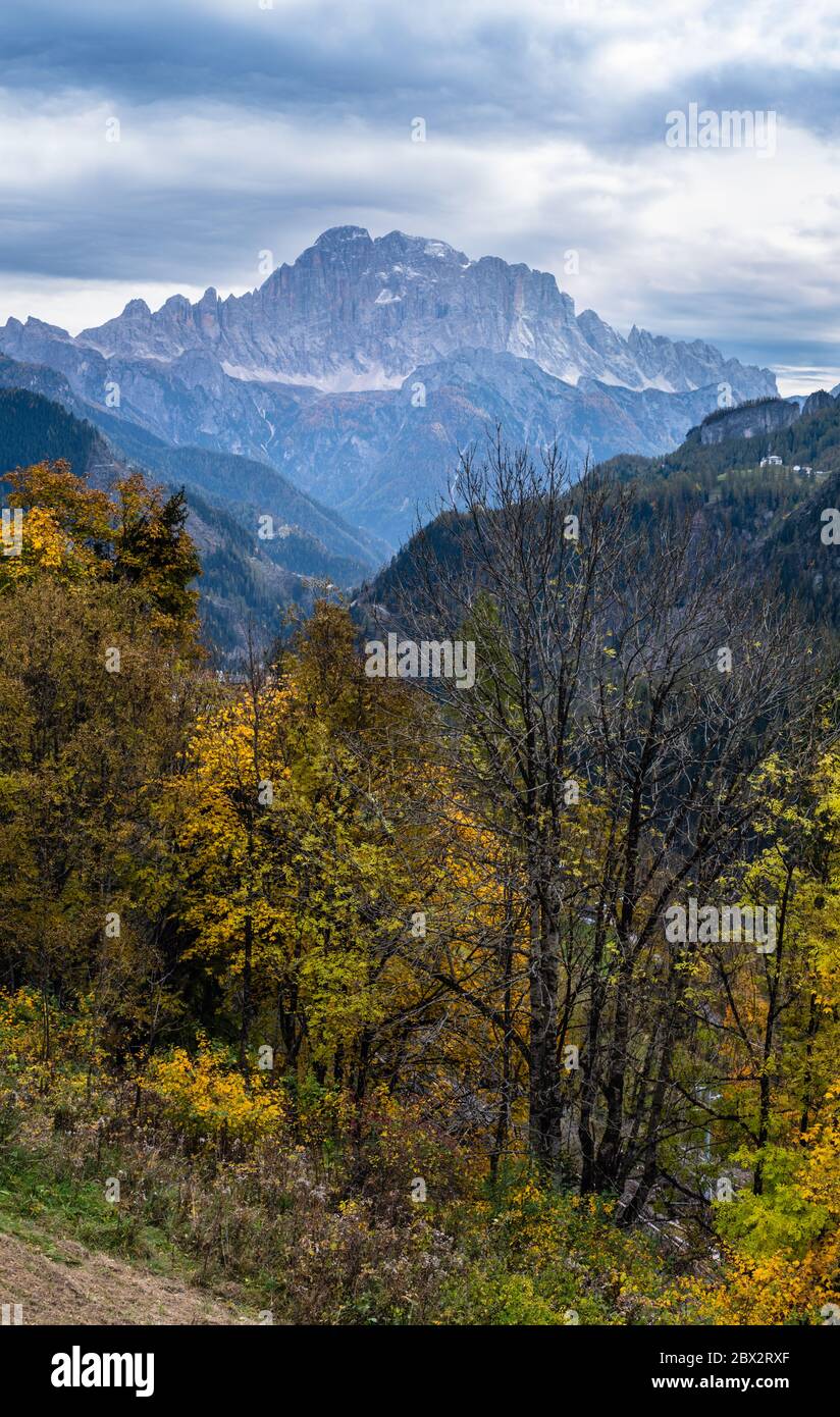 Autumn alpine Dolomites scene. Monte Civetta mountain top in far view from Livinallongo del Col di Lana, Belluno, Italy. Stock Photo