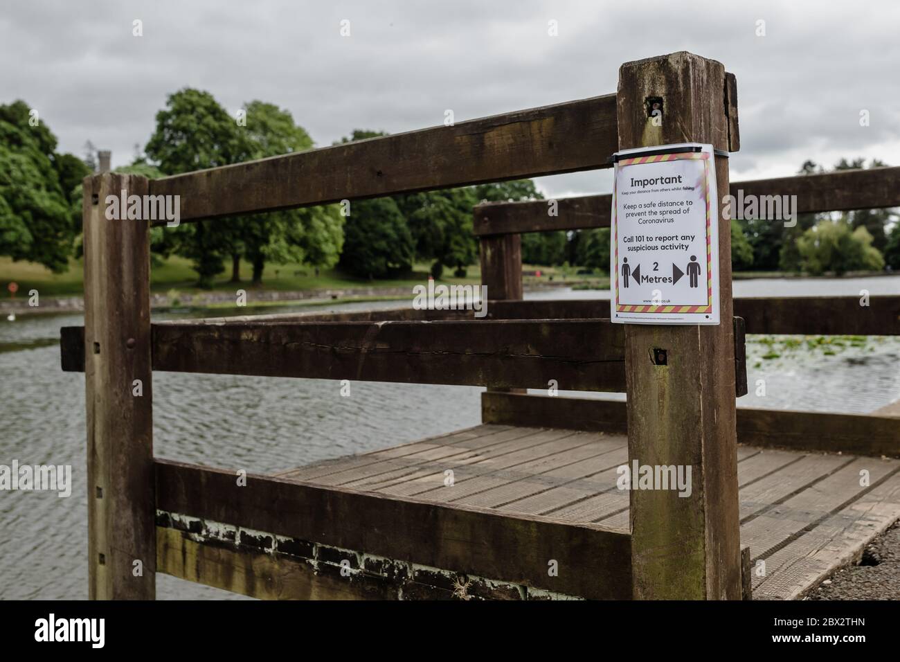 MERTHYR TYDFIL, Wales 04 JUNE 2020 Cyfarthfa Park lake with a sign