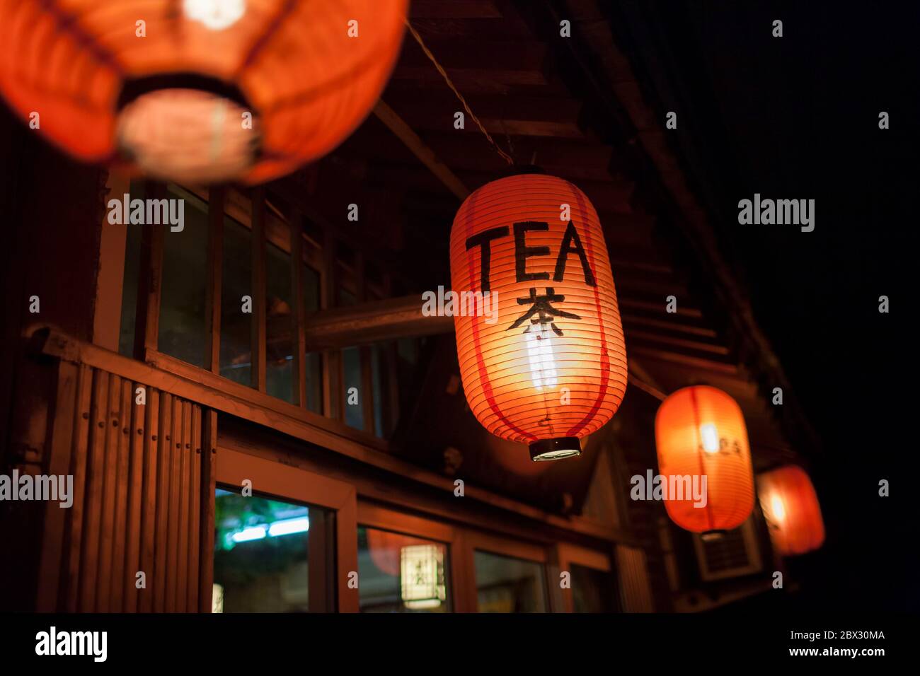 China, Beijing Municipality, City of Beijing, night view of traditional  lanterns illuminated, announcing a teahouse Stock Photo - Alamy