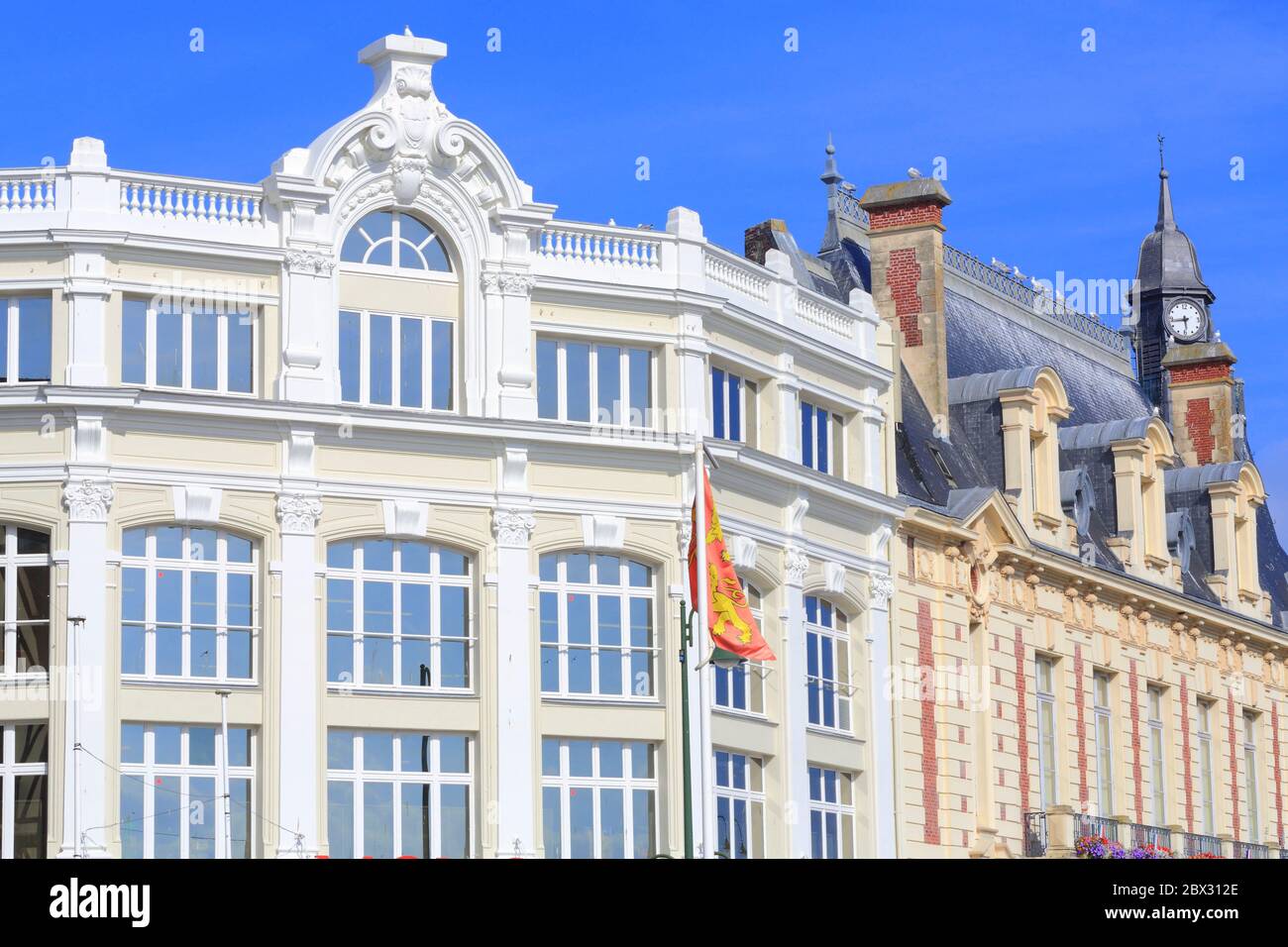 France, Calvados, Pays d'Auge, Trouville sur Mer, on the left Monoprix (ex Galeries Modernes) and on the right the town hall (19th century) Stock Photo