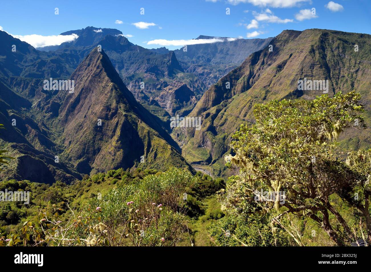 France, Reunion island (French overseas department), Reunion National Park listed as World heritage by UNESCO, La Possession, around village of Dos d'Ane, Roche Bouteille hike by the Cap Noir trail, Piton Cabris left in the Cirque de Mafate Stock Photo