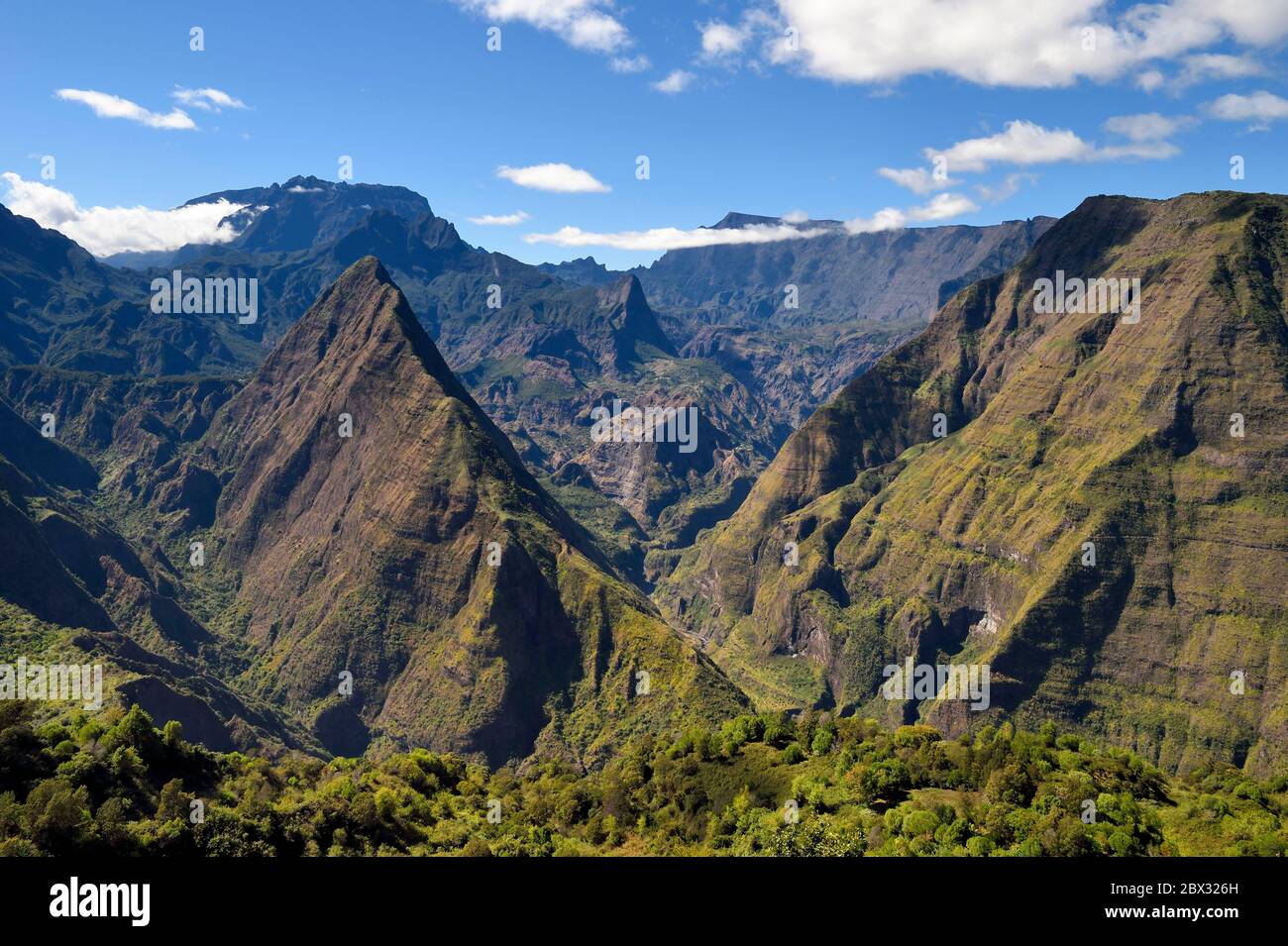 France, Reunion island (French overseas department), Reunion National Park listed as World heritage by UNESCO, La Possession, around village of Dos d'Ane, Roche Bouteille hike by the Cap Noir trail, Piton Cabris left in the Cirque de Mafate Stock Photo