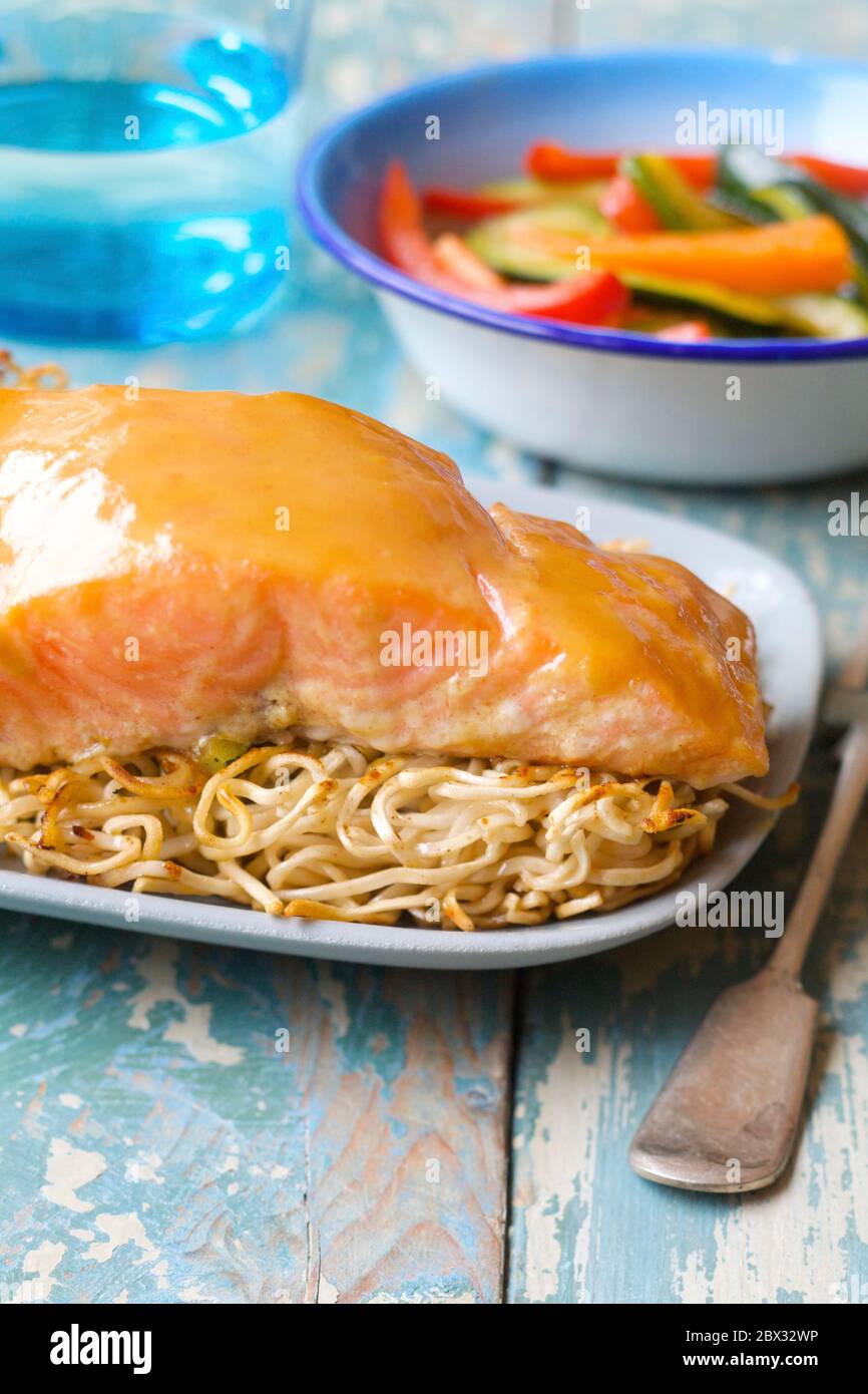 Crispy salmon and noodles Stock Photo - Alamy