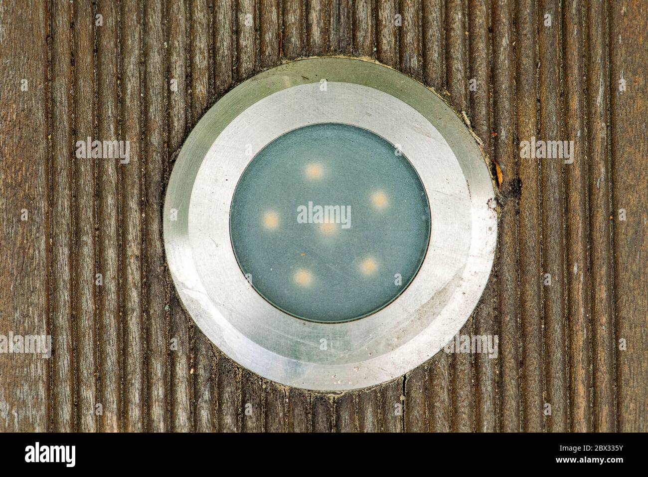 Installation LED spotlight in the wooden terrace for outside Stock Photo