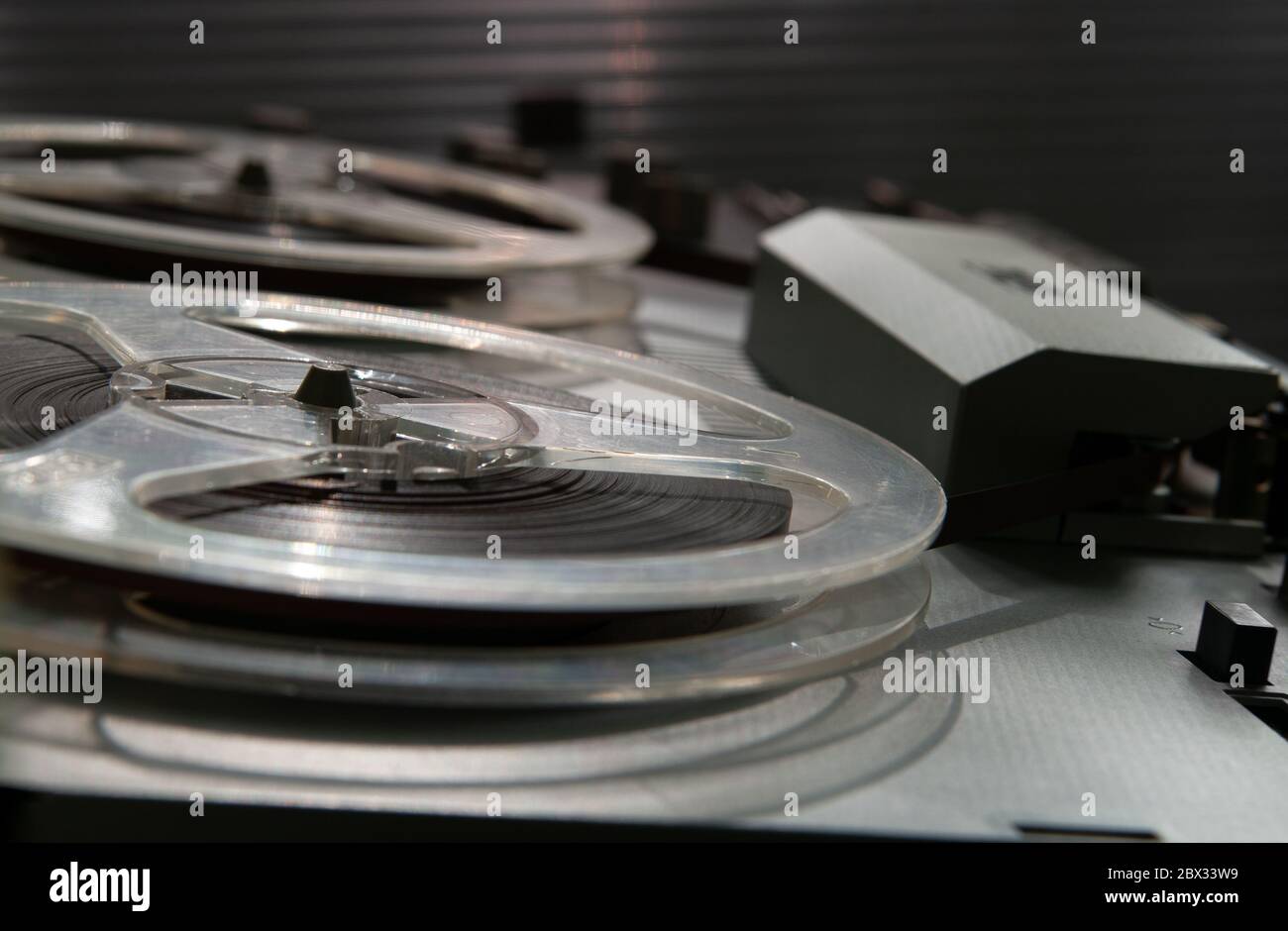 Old vintage reeltoreel player. Tape recorder with spools. Bobbin tape