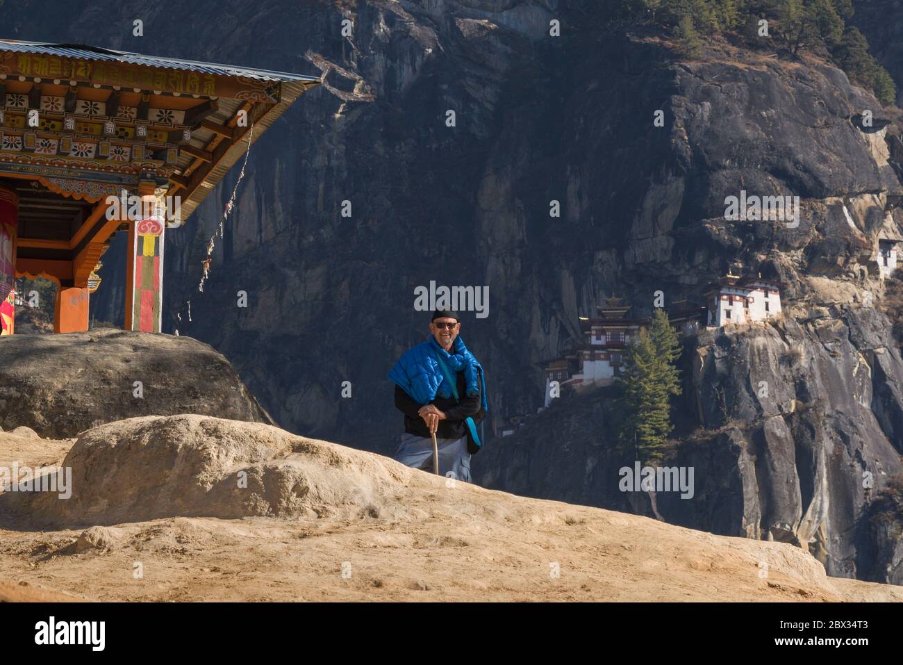 Hiker (model released) on way to Tiger’s Nest Monastery in Bhutan pauses for self-portrait. Stock Photo
