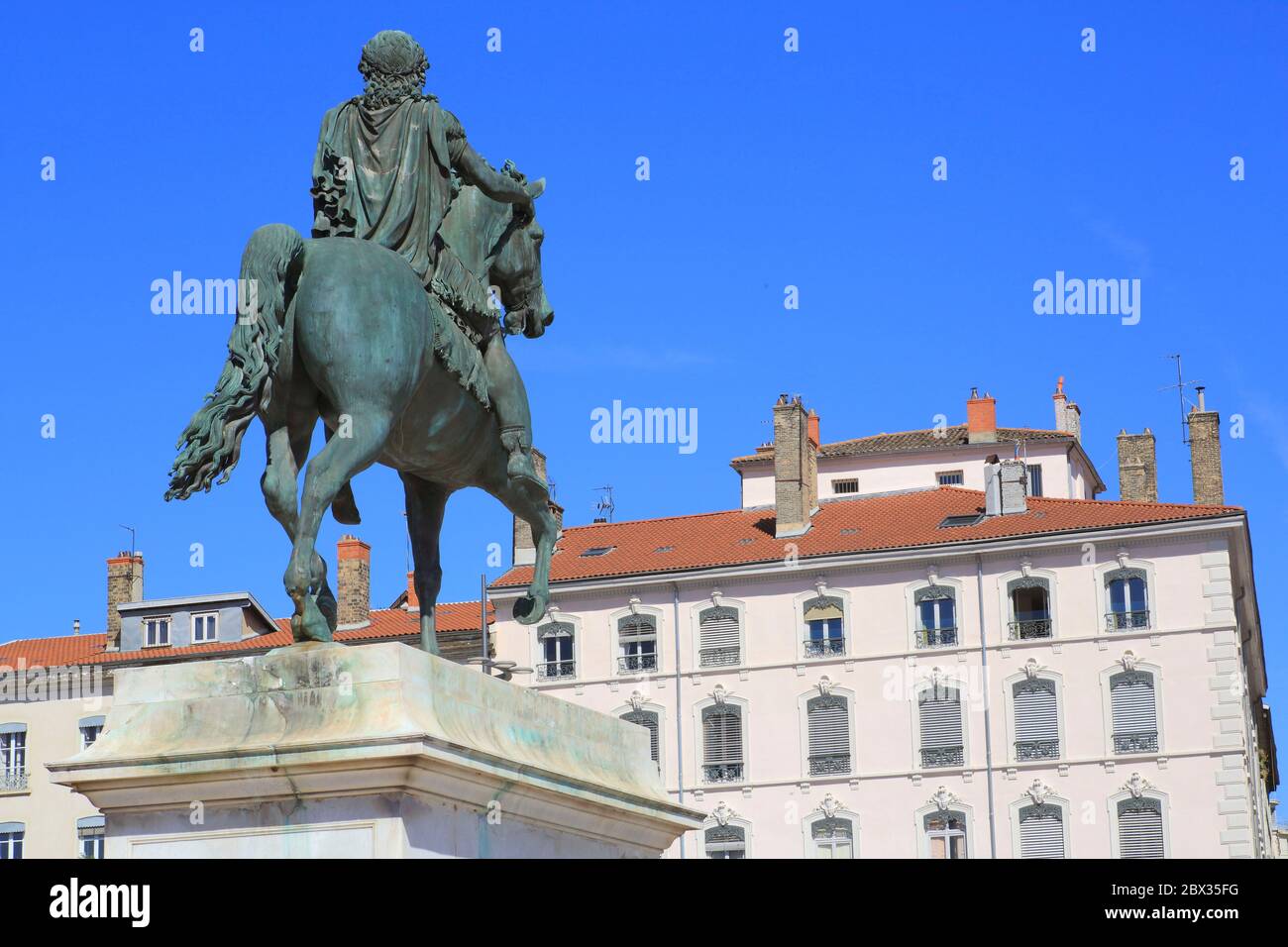 France, Rhone, Lyon, area listed as World Heritage by UNESCO, Place Bellecour, equestrian statue of Louis XIV by sculptor François Frédéric Lemot Stock Photo