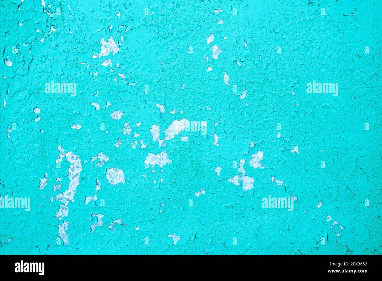 aged cracked blue paint on the cement wall Stock Photo
