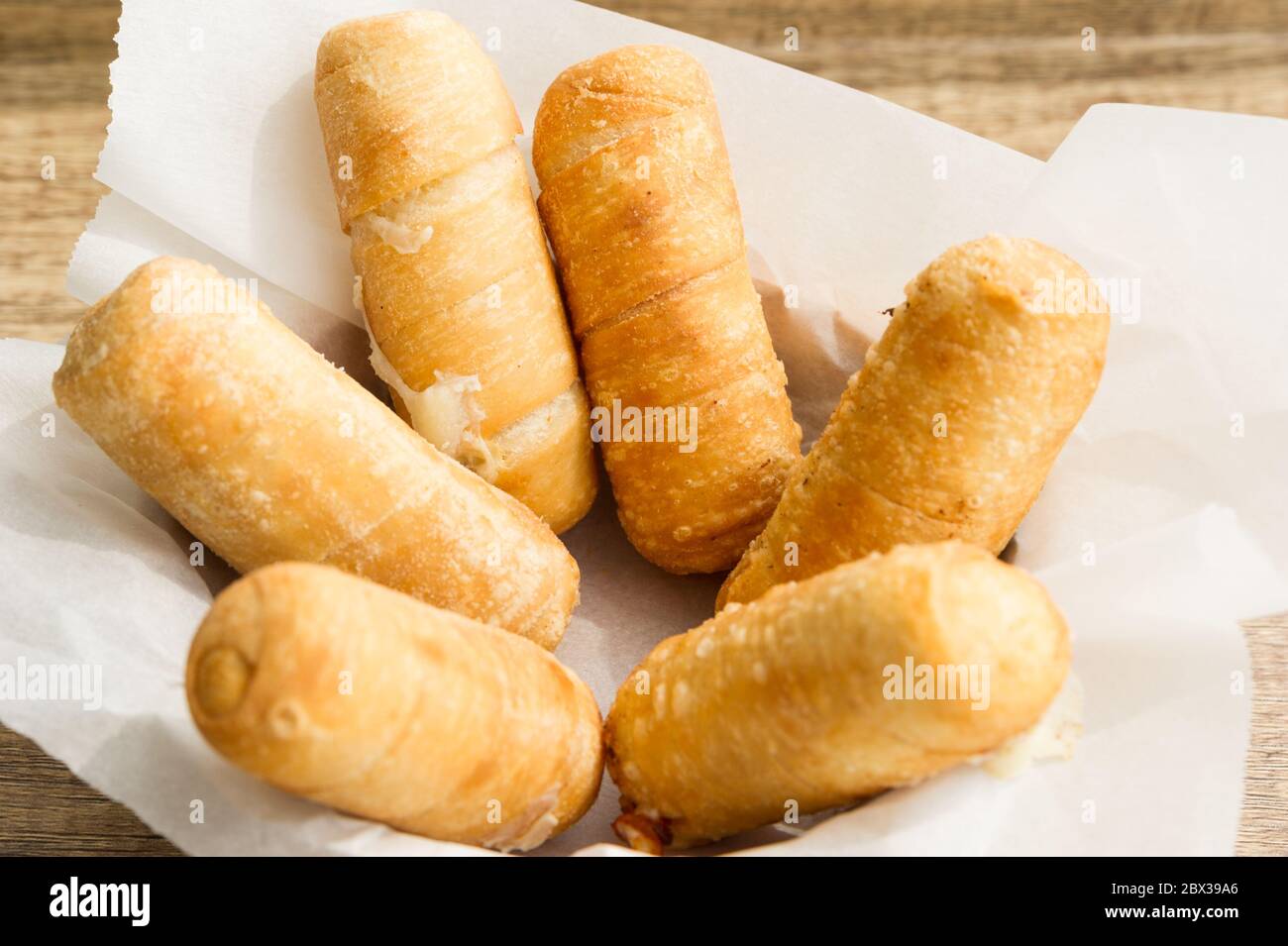 Tequeños authentic original Venezuelan appetizer. Deep fried filled with artesan white cheese. Stock Photo