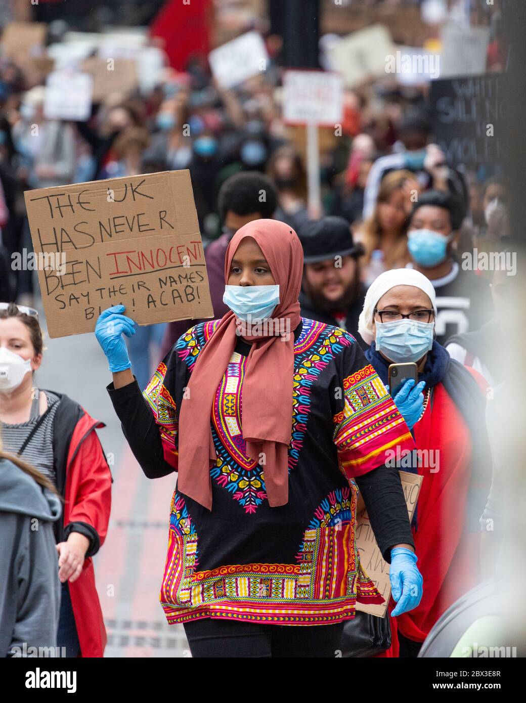 A muslim girl holding up a sign during the march at the Black Lives Matters protest in London, 3 June 2020 Stock Photo