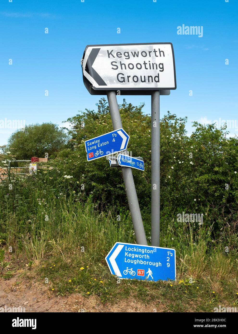 Old country lane road sign showing cycling route directions Stock Photo