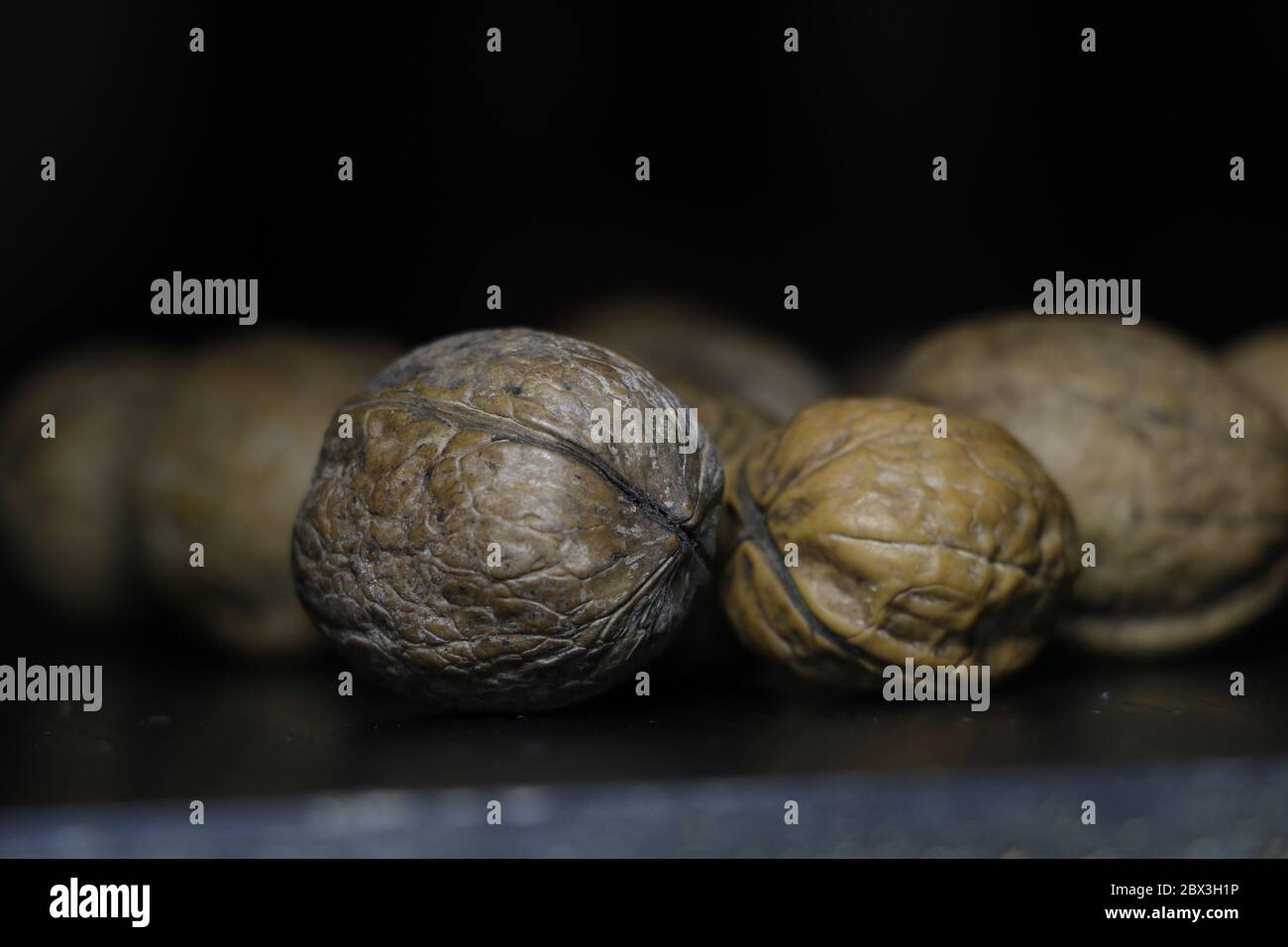 nuts with shell in black background Stock Photo Alamy