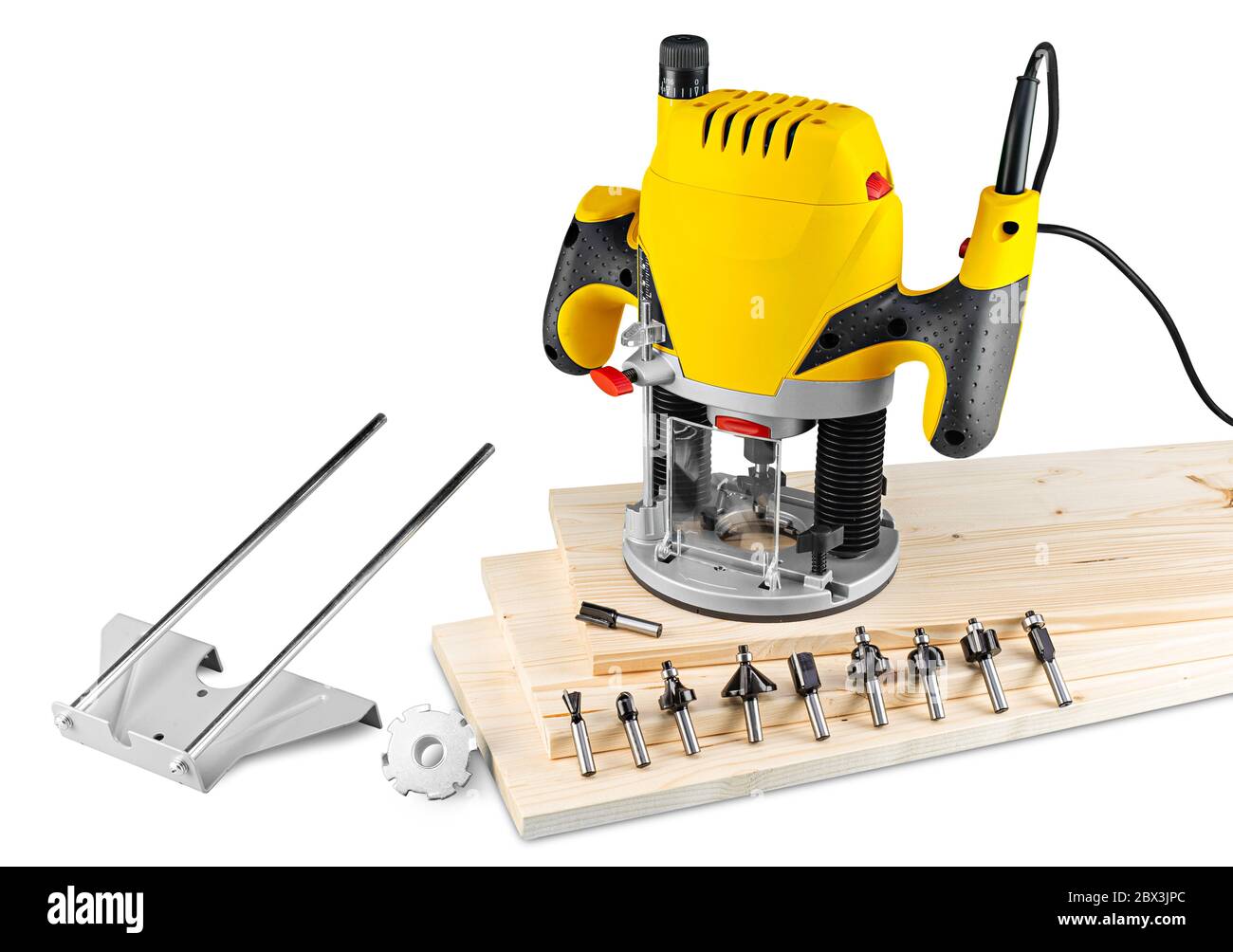 yellow wood router machine with cutter bits guide and copy ring on wooden spruce planks isolated on white background. carpentry construction diy conce Stock Photo