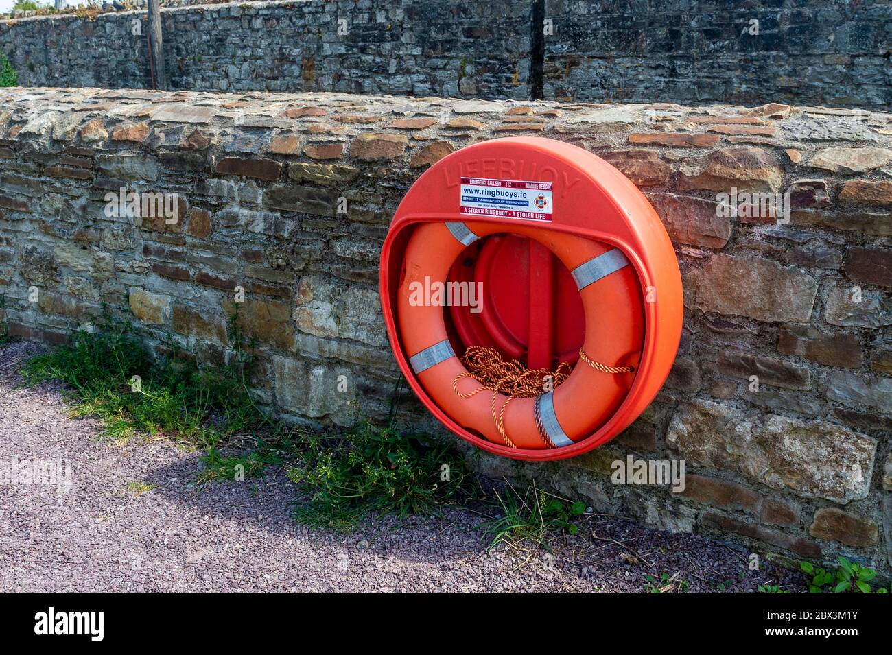 Lifebuoy/Riverside Lifesaving Equipment next to a River. Stock Photo