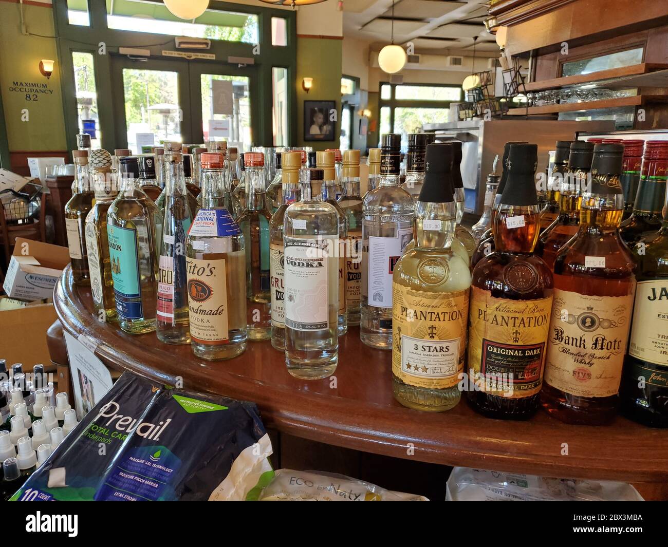 Products including liquor are on display at Tutu's in Lafayette, California, a restaurant which has adopted a general store model selling groceries and supplies during an outbreak of COVID-19 coronavirus, April 14, 2020. () Stock Photo