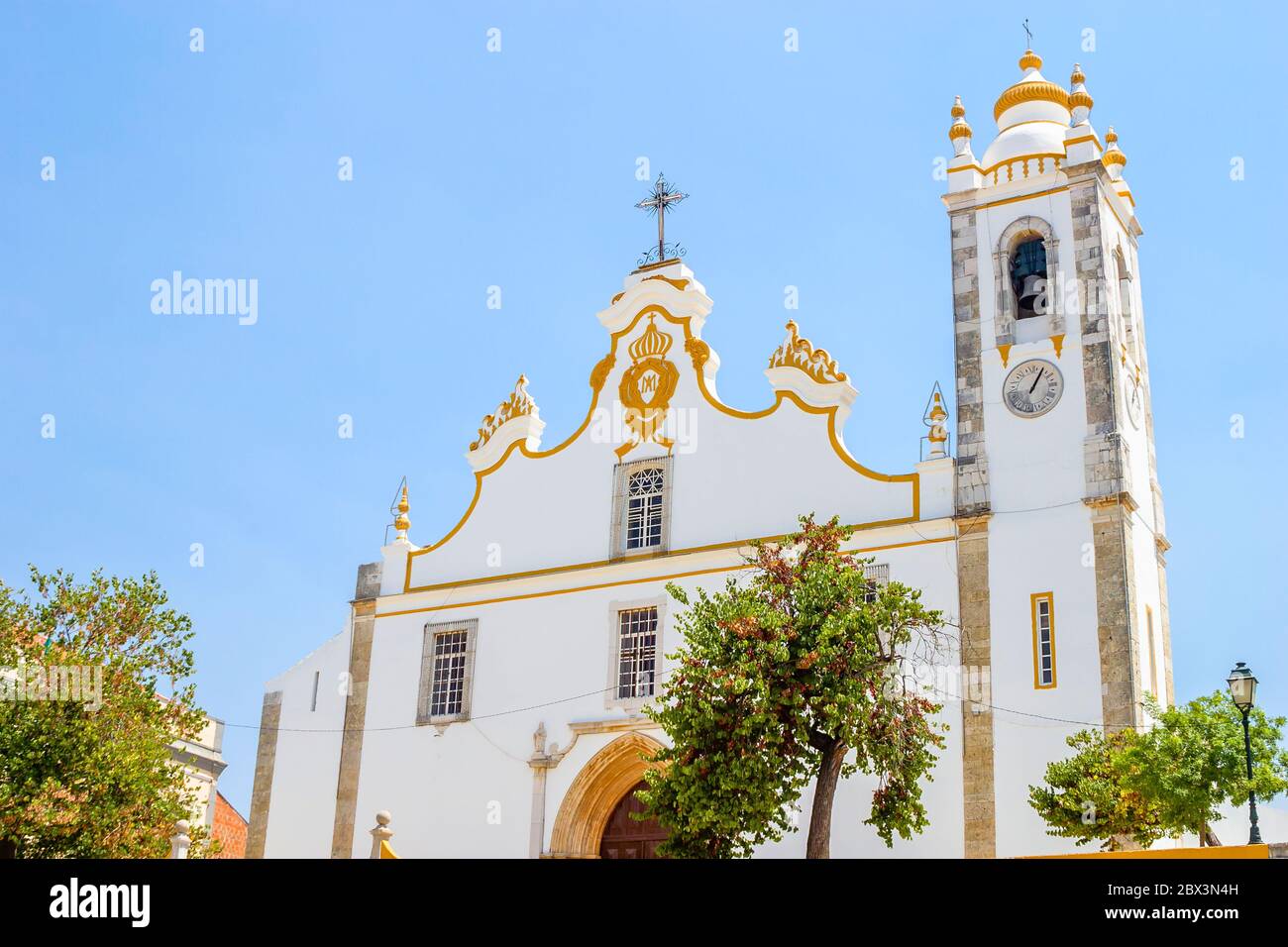 Facade of the historic 15th-century Catholic sanctuary, Igreja de Nossa Senhora da Conceicao church, Portimao, western Algarve, south Portugal Stock Photo