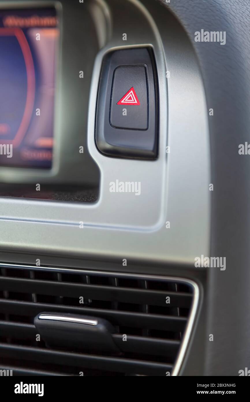 Hazard warning lights, the emergency stop button in the car Stock Photo