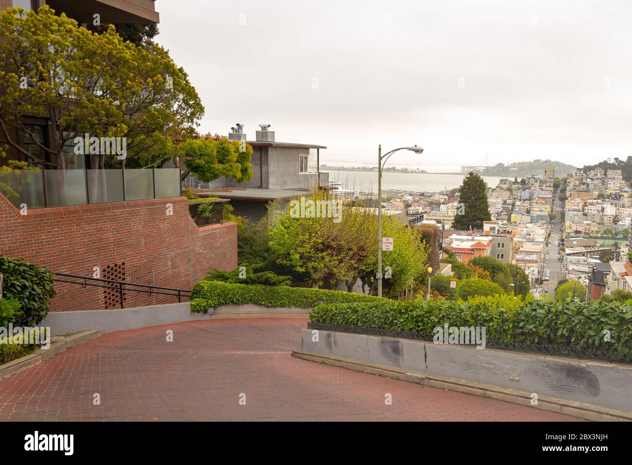 The iconic Lombard Street in San Francisco, California was deserted during an outbreak of the COVID-19 coronavirus, April 8, 2020. () Stock Photo