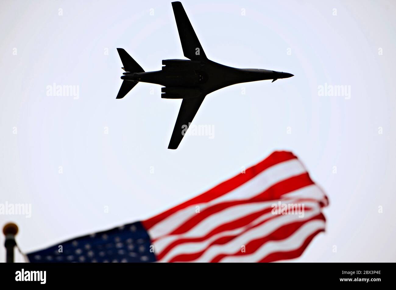 A U.S. Air Force B-1B Lancer stealth bomber aircraft flies over the Norma Brown building during the 75th Diamond Anniversary ceremony on Goodfellow Air Force Base January 26, 2016 in San Angelo, Texas. Stock Photo