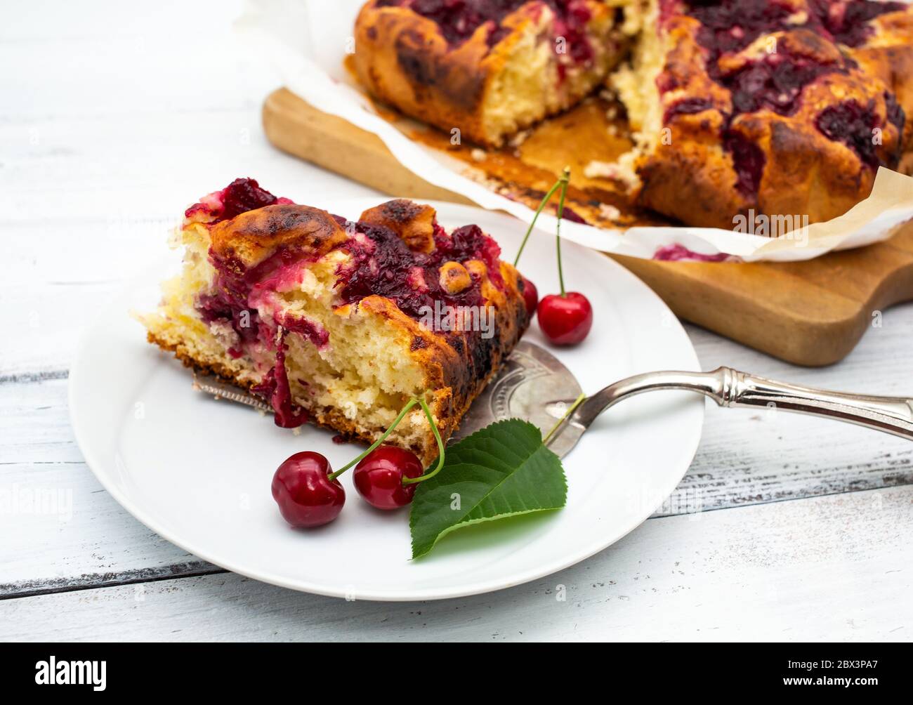 Homemade cherry pie on white rustic wood background Stock Photo - Alamy