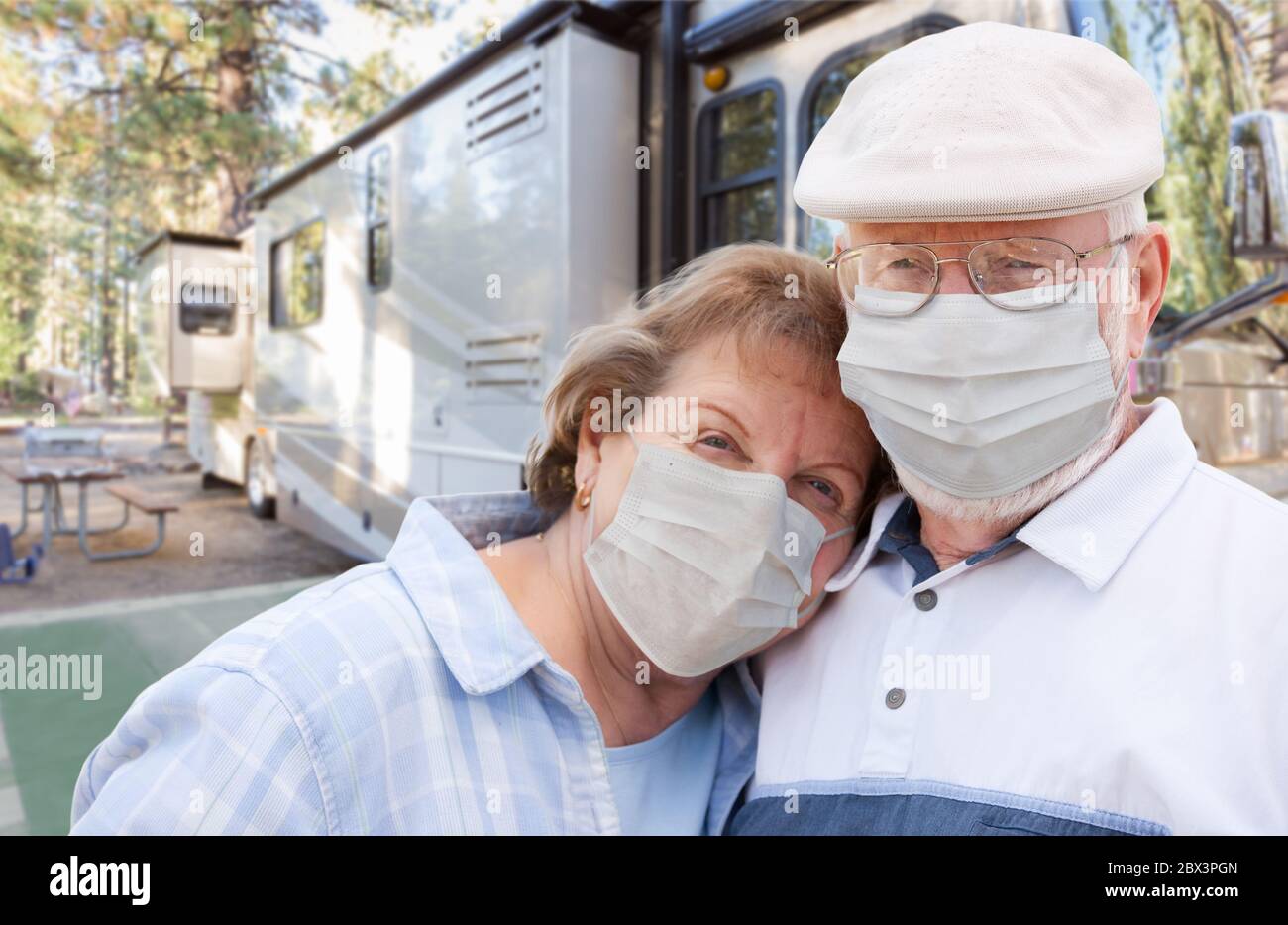 Senior Couple Wearing Medical Face Masks In Front of Their Beautiful RV ...