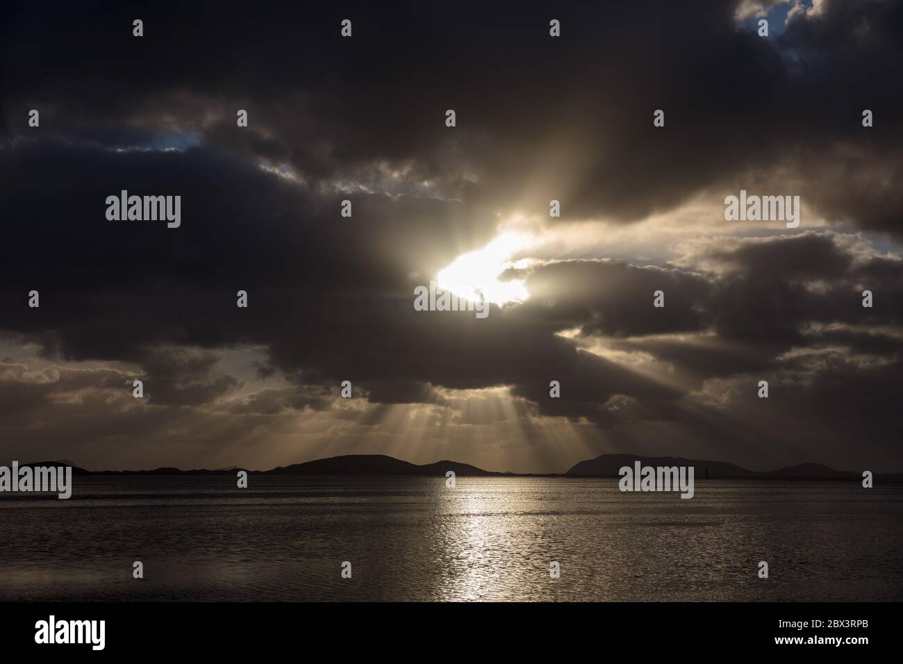 Dramatic light over the ocean at Albany in Western Australia at dawn Stock Photo