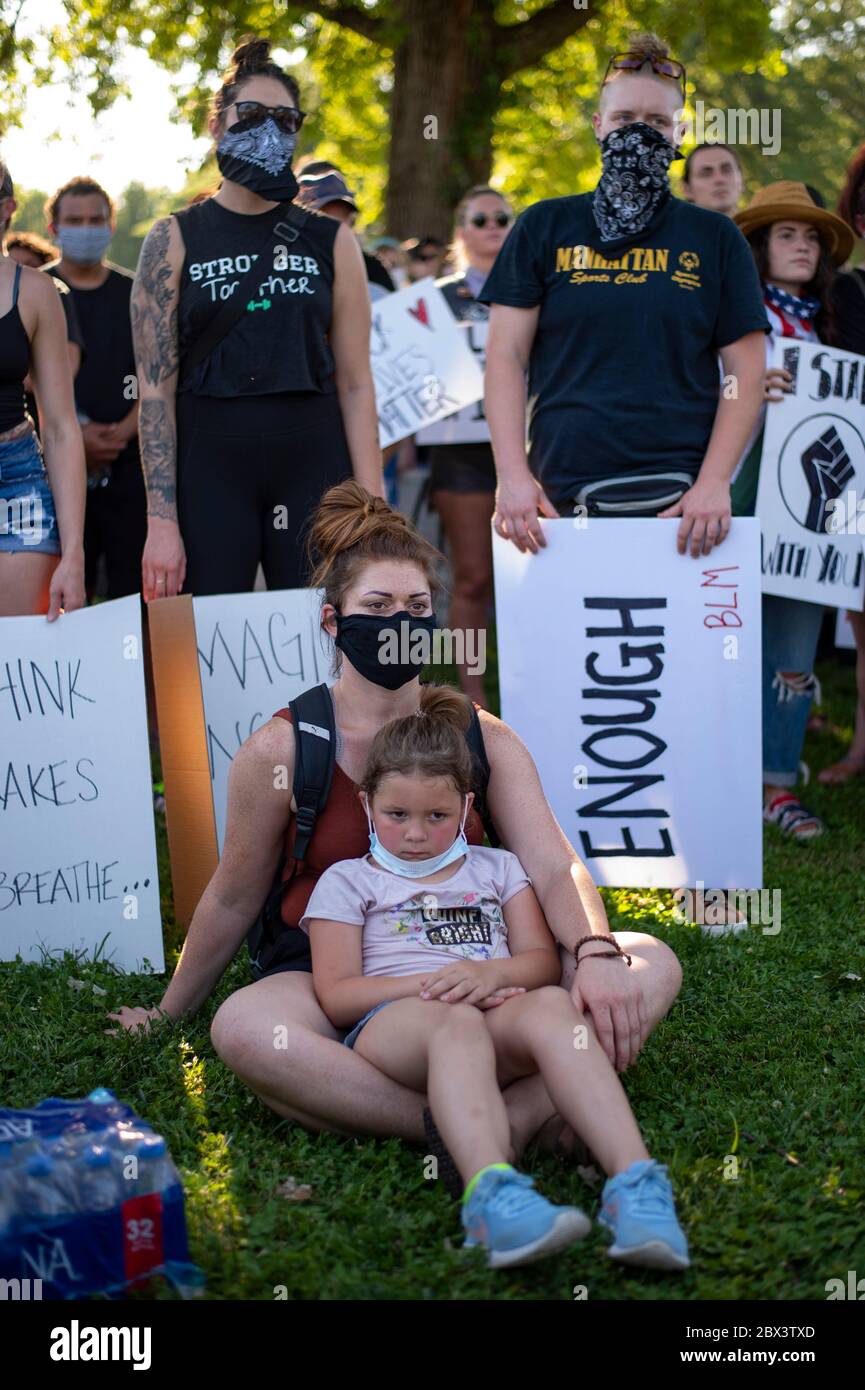 Manhattan, Kansas, USA. 3rd June, 2020. Peaceful protesters listen to an emotional speech by Taneika Nicole during a peaceful protest in City Park on Wednesday. The protest was organized in response to the death of George Floyd by Minneapolis police last week. Credit: Luke Townsend/ZUMA Wire/Alamy Live News Stock Photo