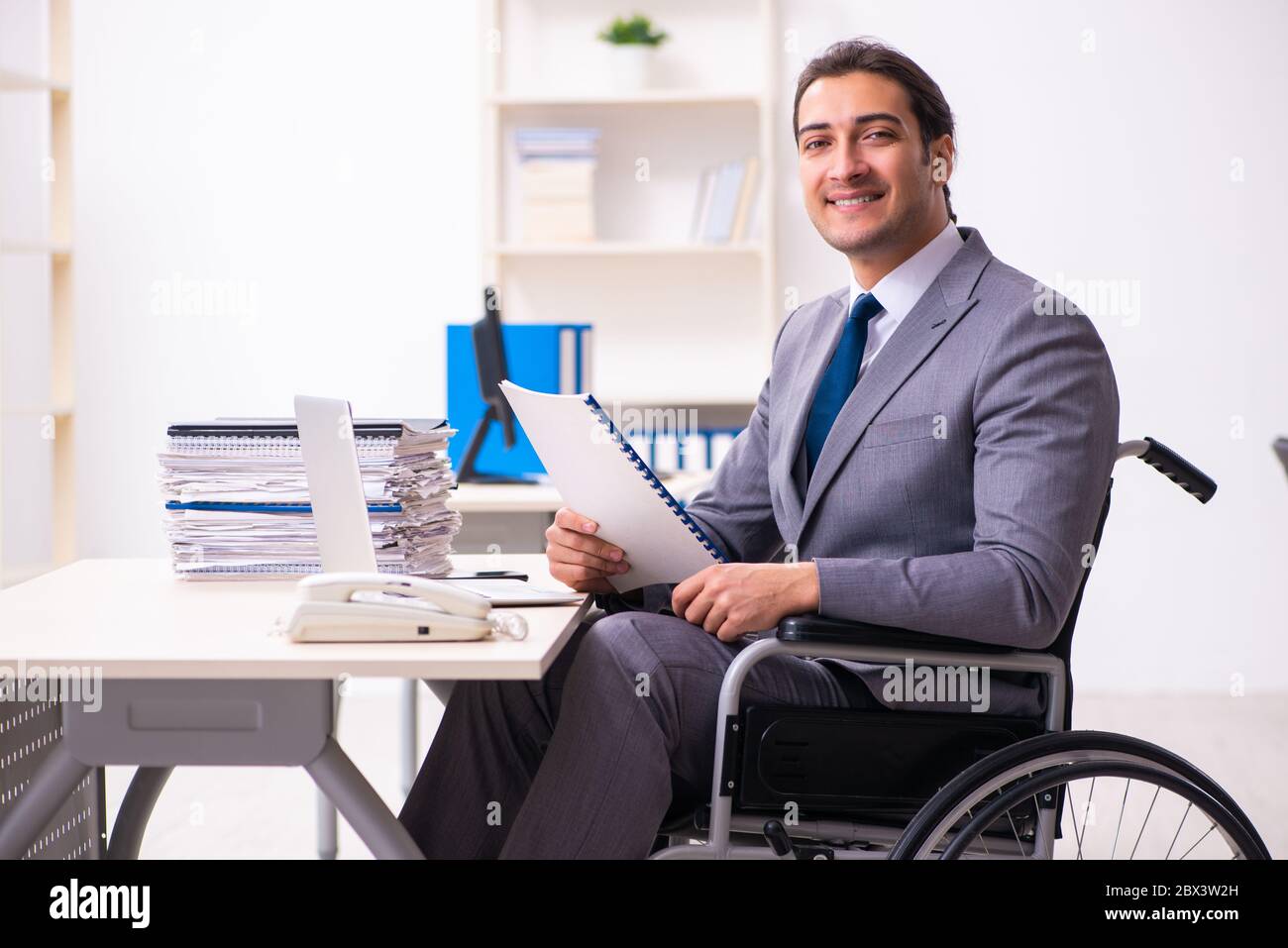 Disabled employee in the office environment Stock Photo - Alamy