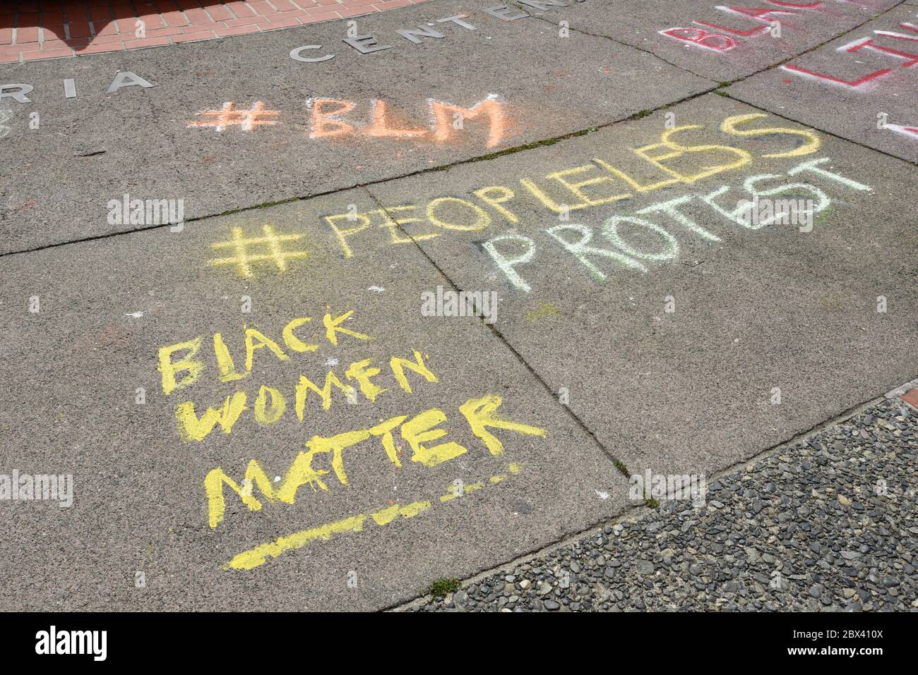 Chalk and paint were used to make up the slogans dotting the plaza next to city hall in Victoria, British Columbia, Canada on Vancouver Island, part o Stock Photo