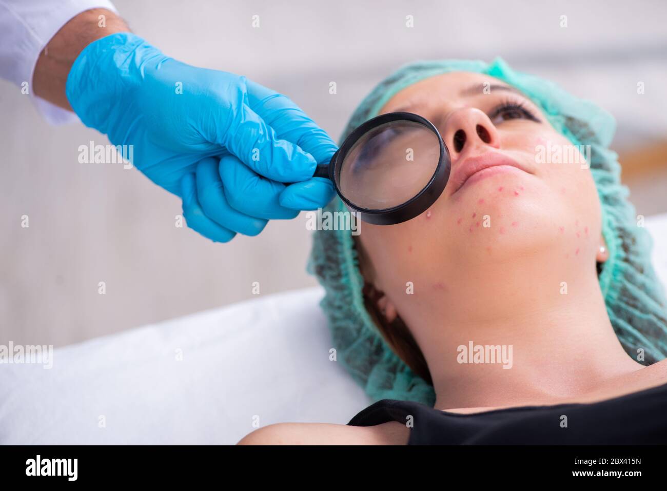 Young woman visiting doctor dermatologist Stock Photo Alamy
