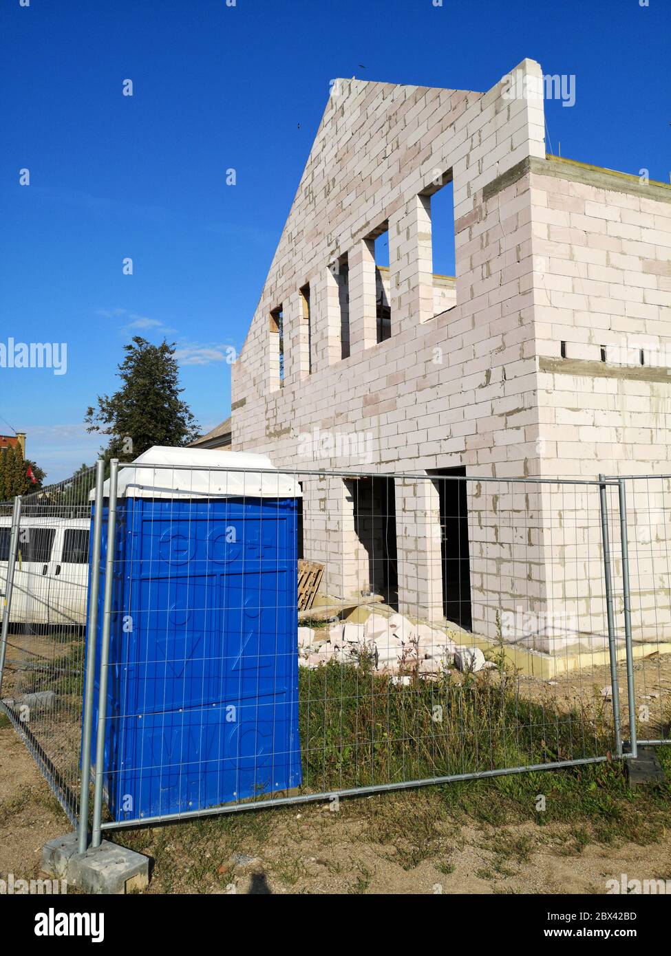 Building site with new white bricks homes under construction Stock Photo