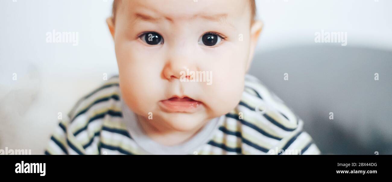 portrait of unhappy baby crying out loud Stock Photo Alamy