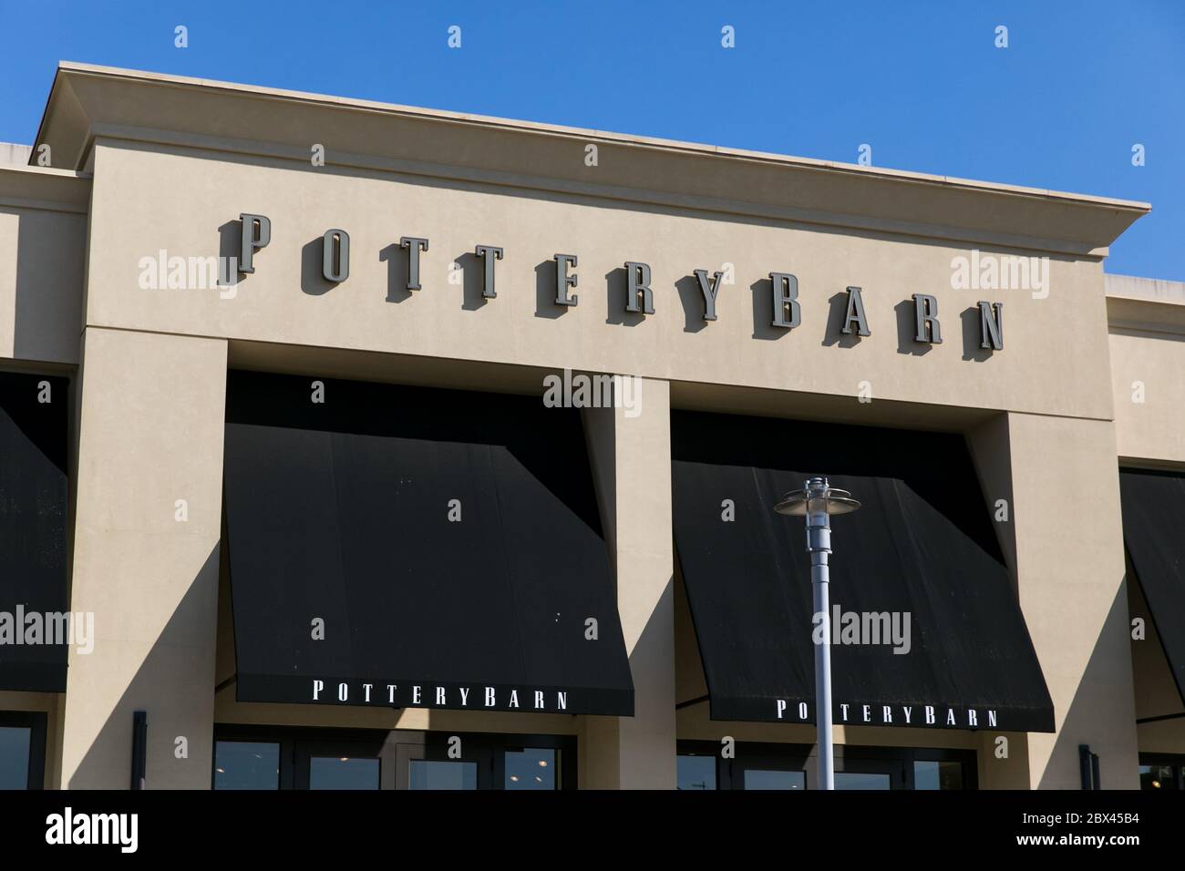 A logo sign outside of a Pottery Barn retail store location in Annapolis, Maryland on May 25, 2020. Stock Photo