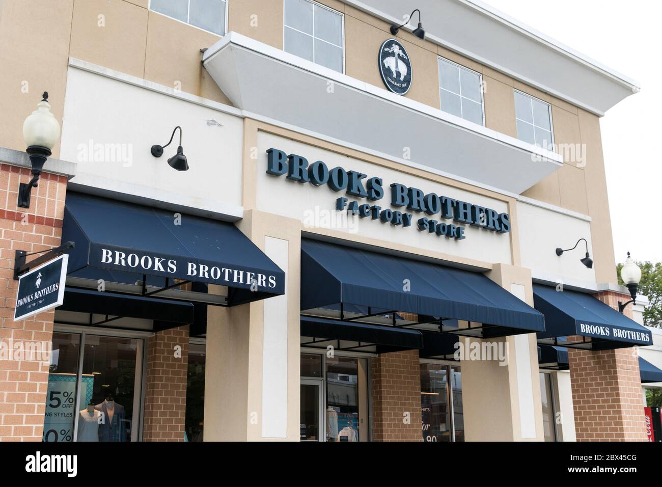 A logo sign outside of a Brooks Brothers Factory retail store in Queenstown, Maryland on May 25, 2020. Stock Photo