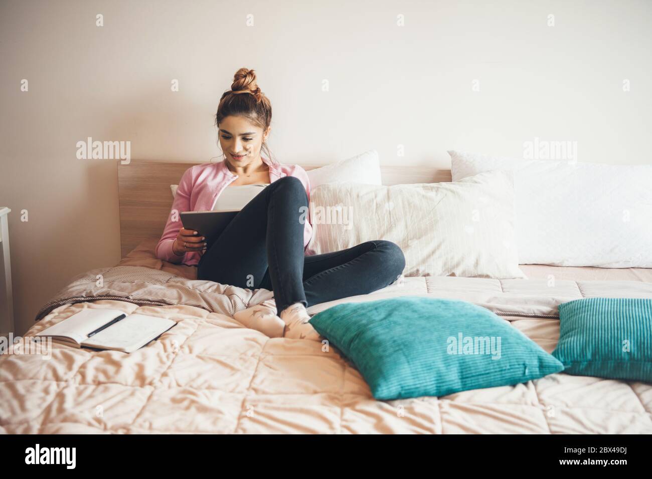 Young woman lying in bed and reading a book hi-res stock photography and  images - Page 3 - Alamy