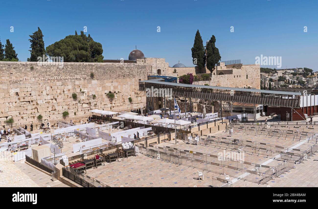 a nearly empty western wall plaza in Jerusalem showing social distancing layouts for worshippers next to the mughrabi bridge and al-aksa mosque Stock Photo