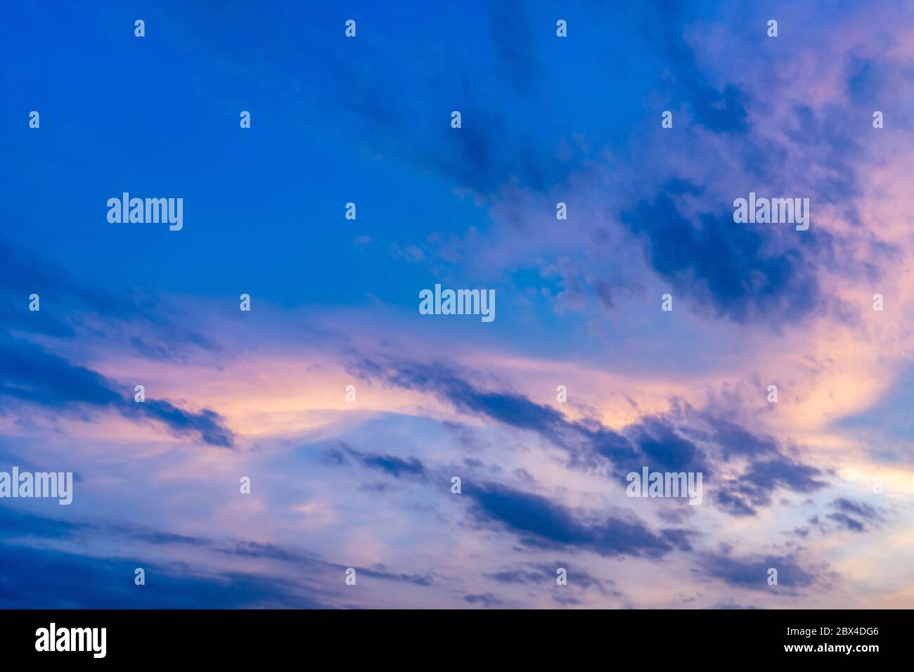 Twilight sky with fluffy cloud in summer evening Stock Photo