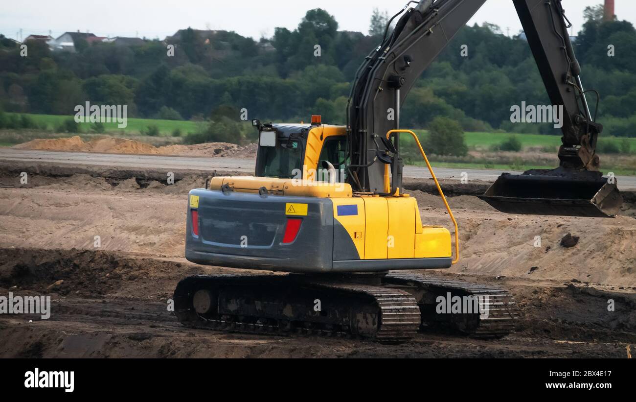 Road-building. Bulldozer, excavator and dump truck operation Stock Photo