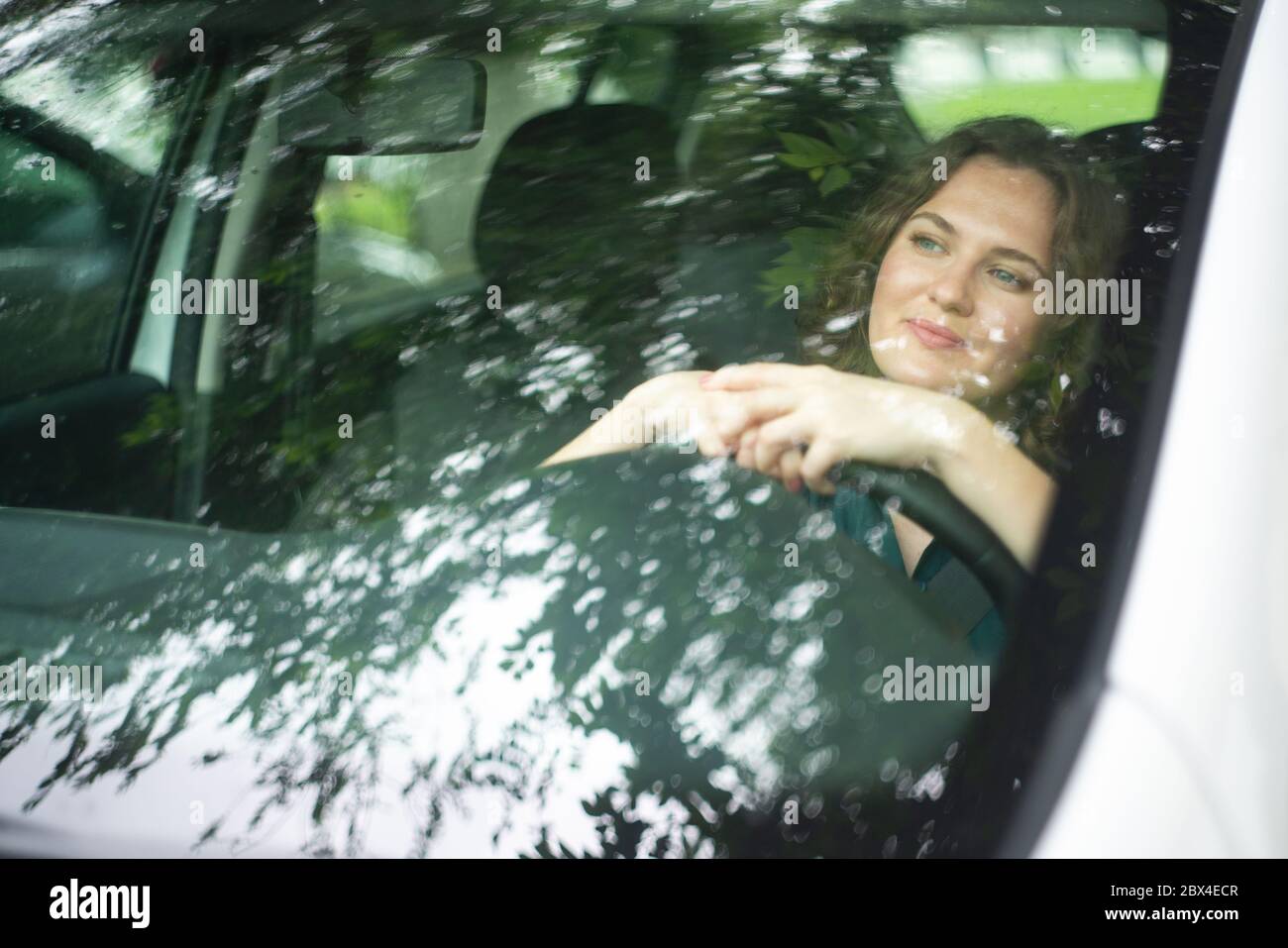 Woman driver driving a car Stock Photo