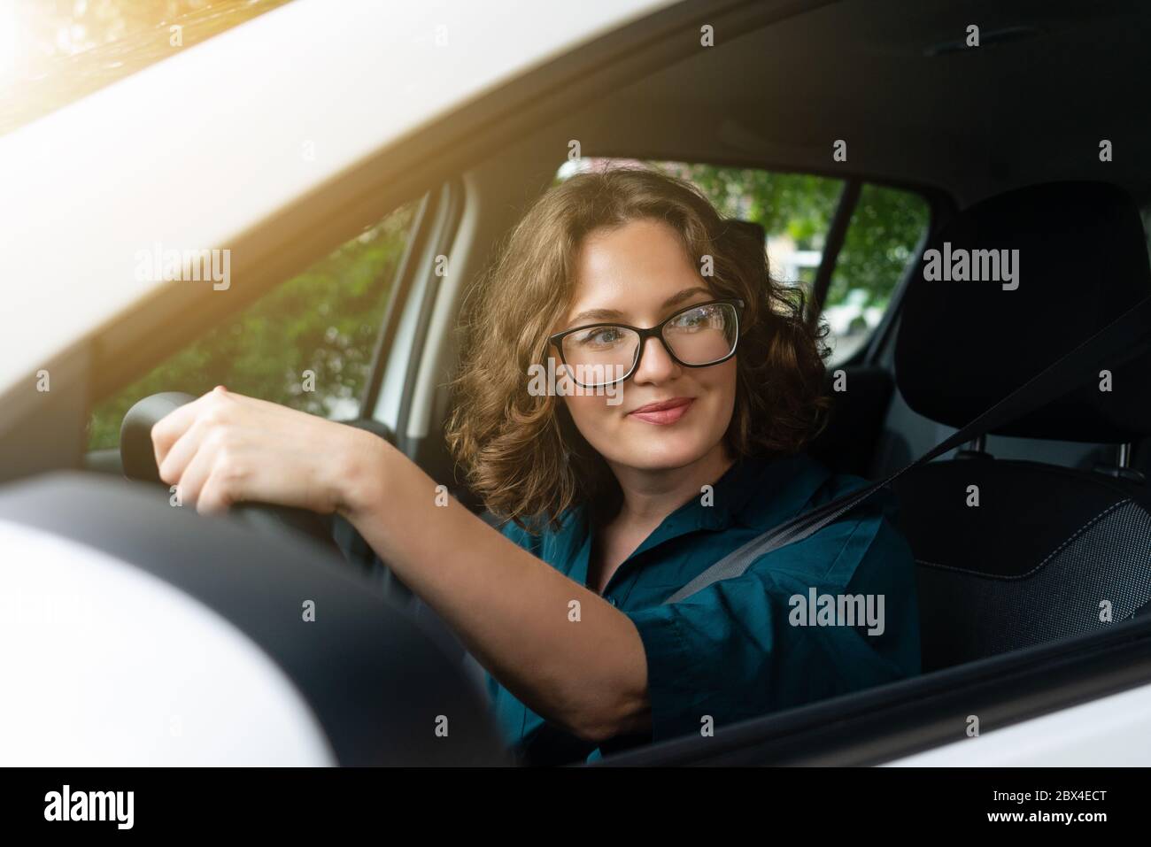 Woman driver driving a car Stock Photo