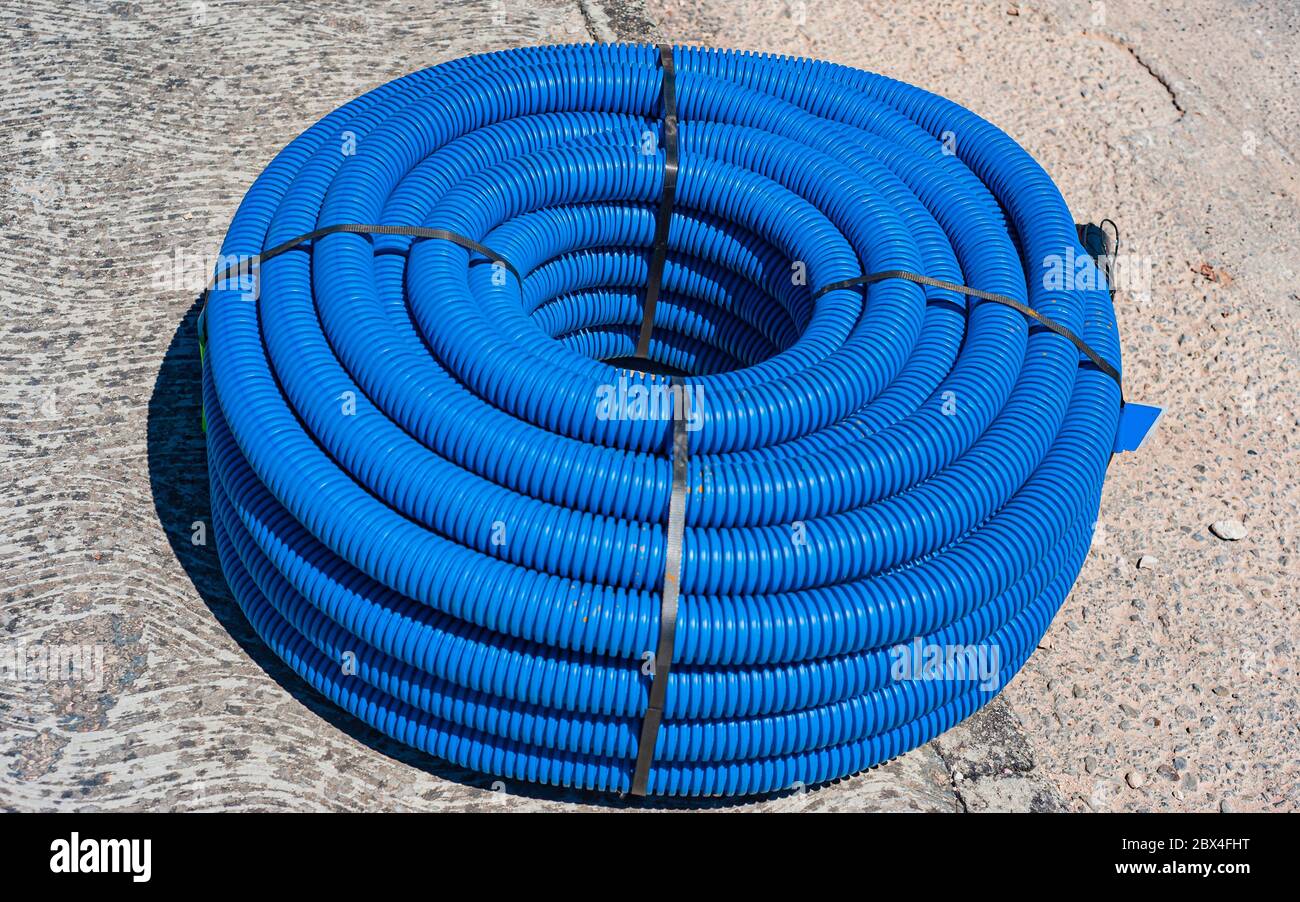 Flexible plastic tube use for cable wiring roll of white flexible conduit Stock Photo