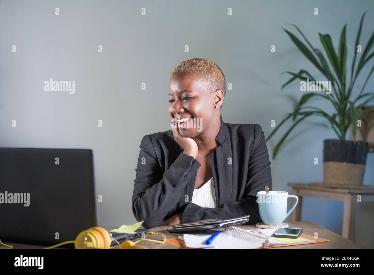 young attractive and happy successful black afro american woman in