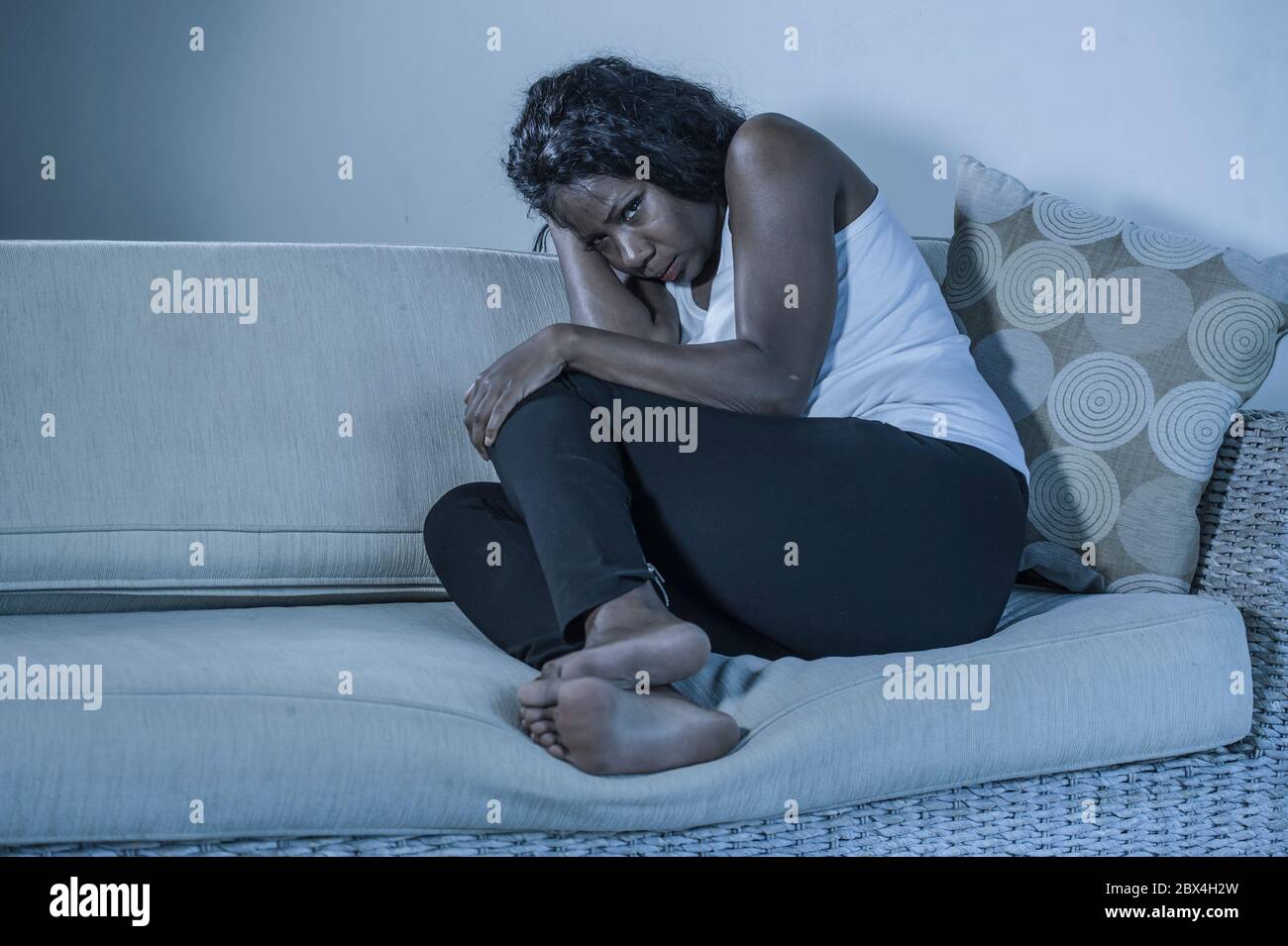 young attractive and sad black African American woman sitting depressed ...